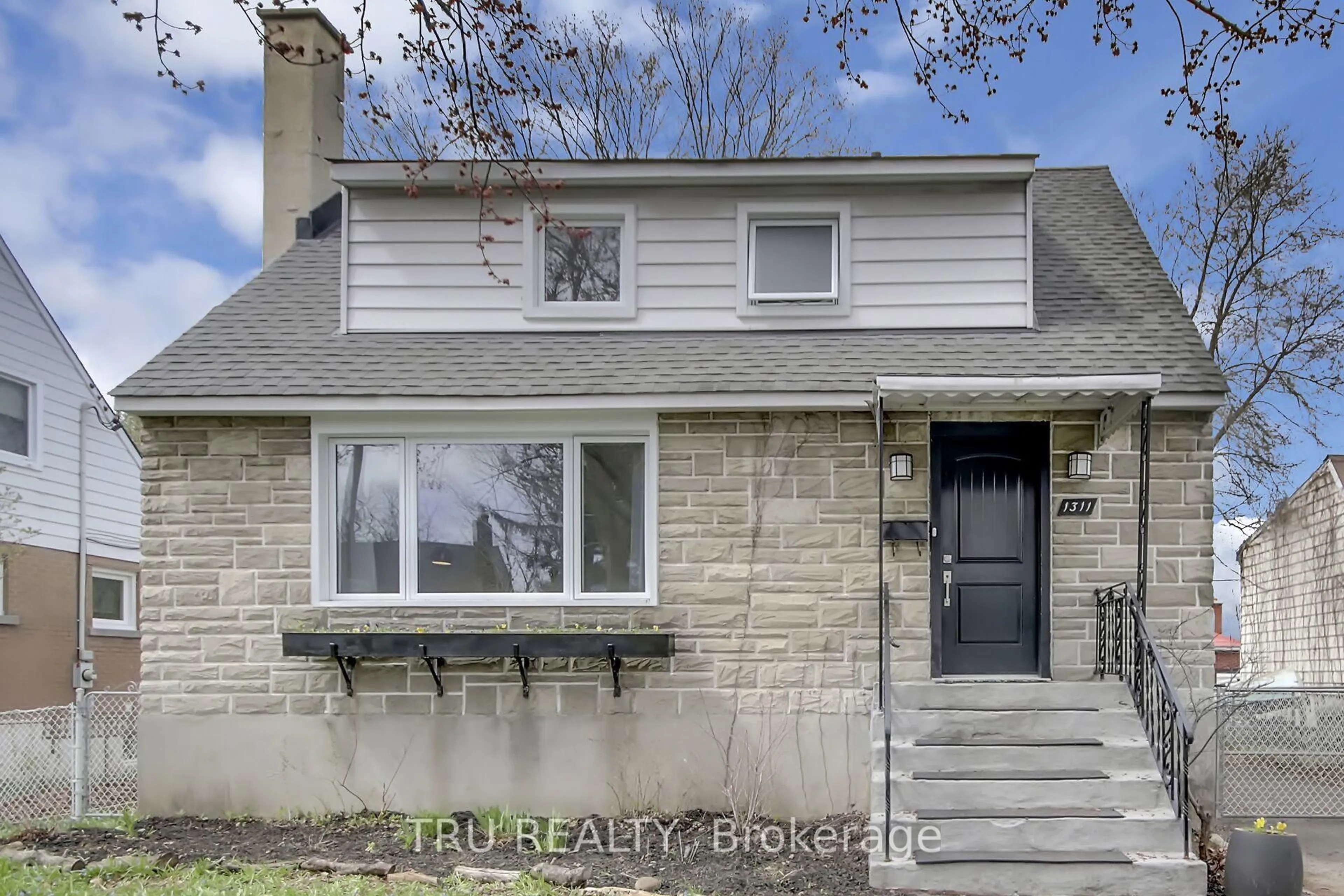 Home with brick exterior material, street for 1311 LAPERRIERE Ave, Ottawa Ontario K1Z 7R9