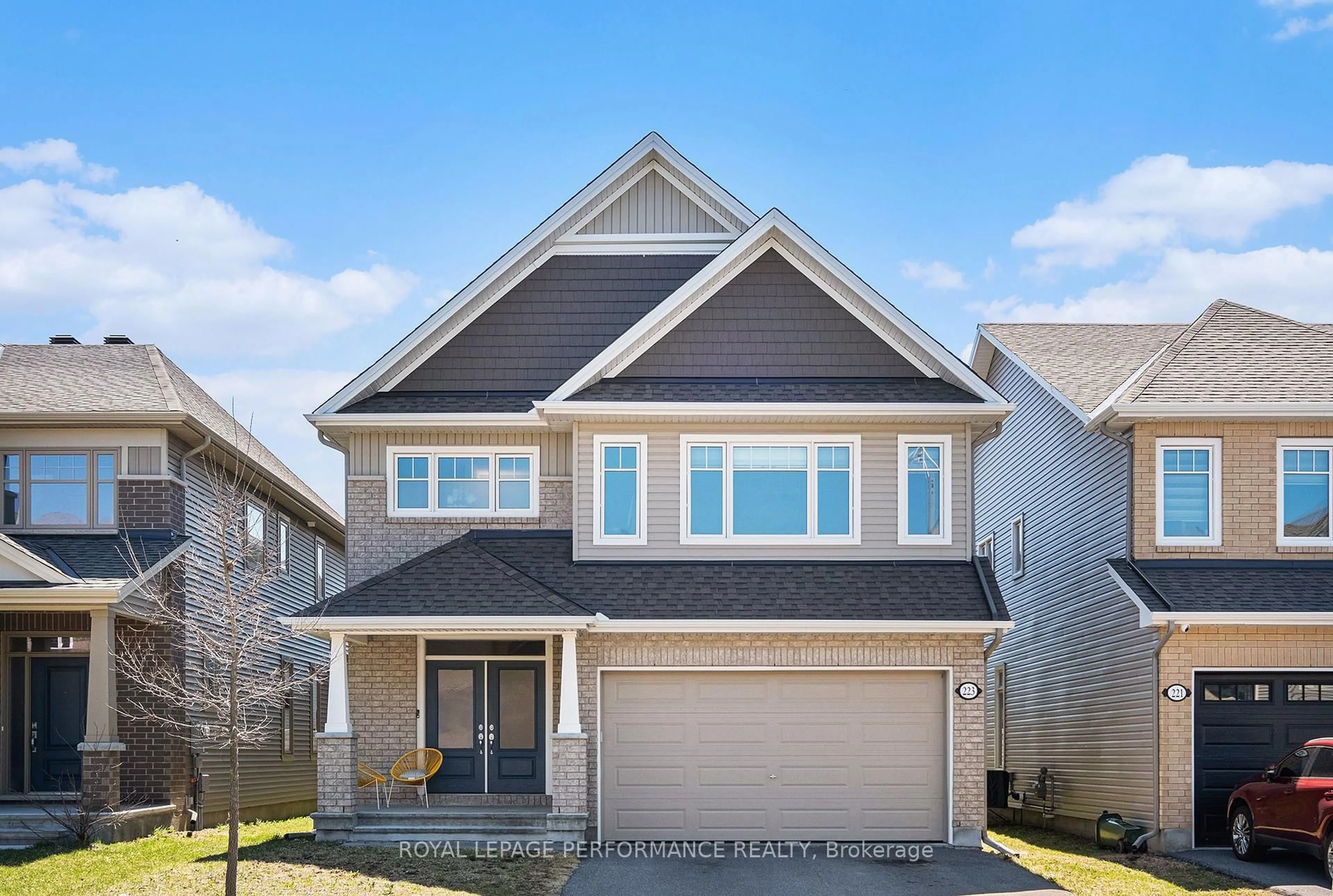 Home with vinyl exterior material, street for 223 Trollius Way, Ottawa Ontario K1T 0R7