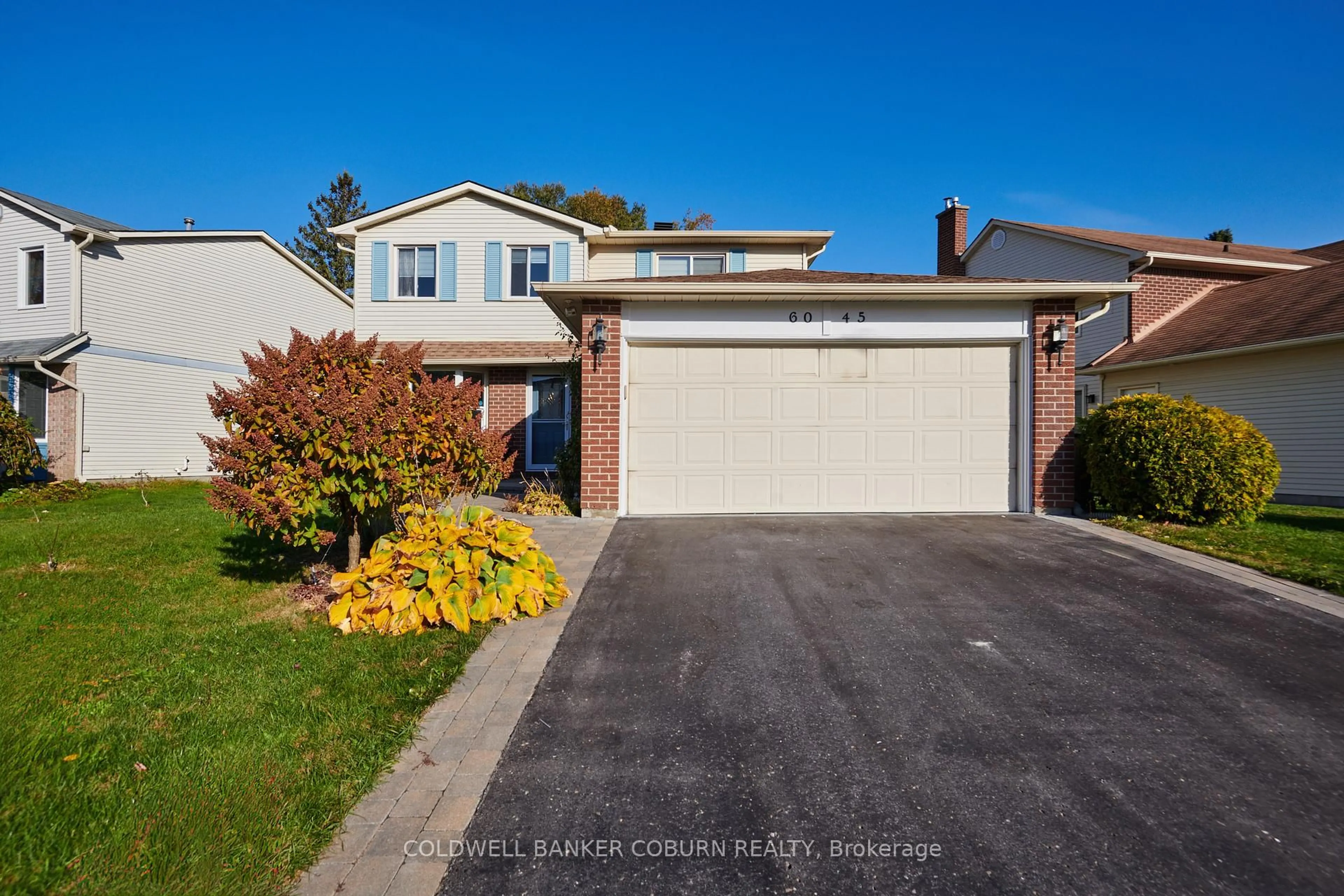 Home with vinyl exterior material, street for 6045 Voyageur Dr, Ottawa Ontario K1C 2P5