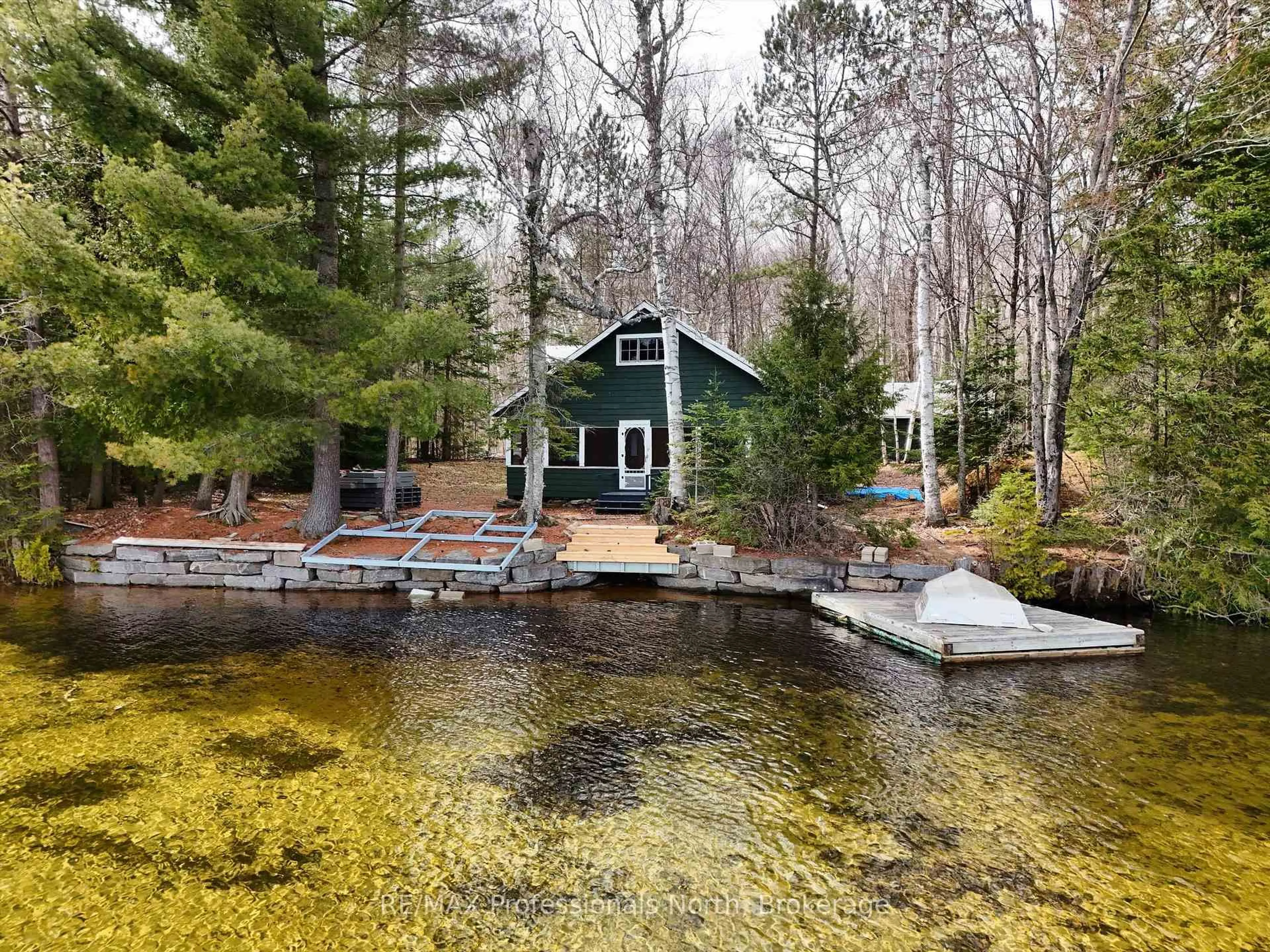 A pic from outside/outdoor area/front of a property/back of a property/a pic from drone, water/lake/river/ocean view for 1411 Billie Bear Rd #3, Lake of Bays Ontario P1H 2J6