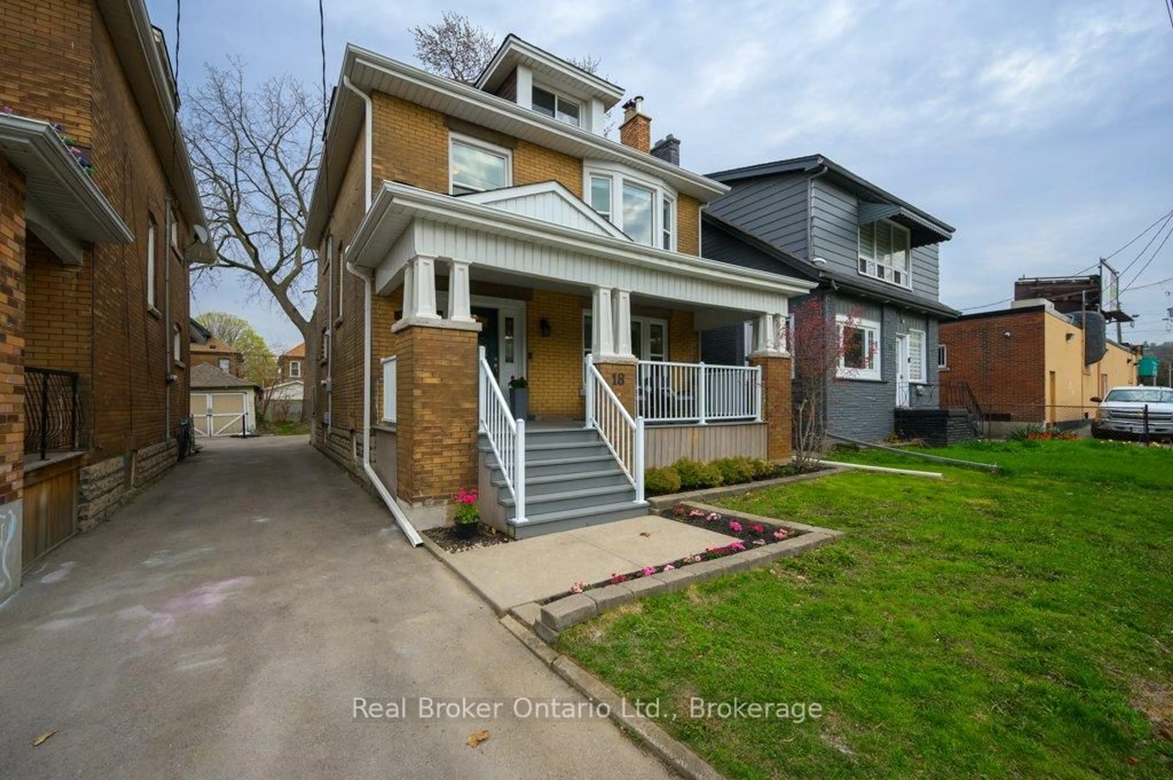 Home with brick exterior material, street for 18 Kensington Ave, Hamilton Ontario L8L 7M9