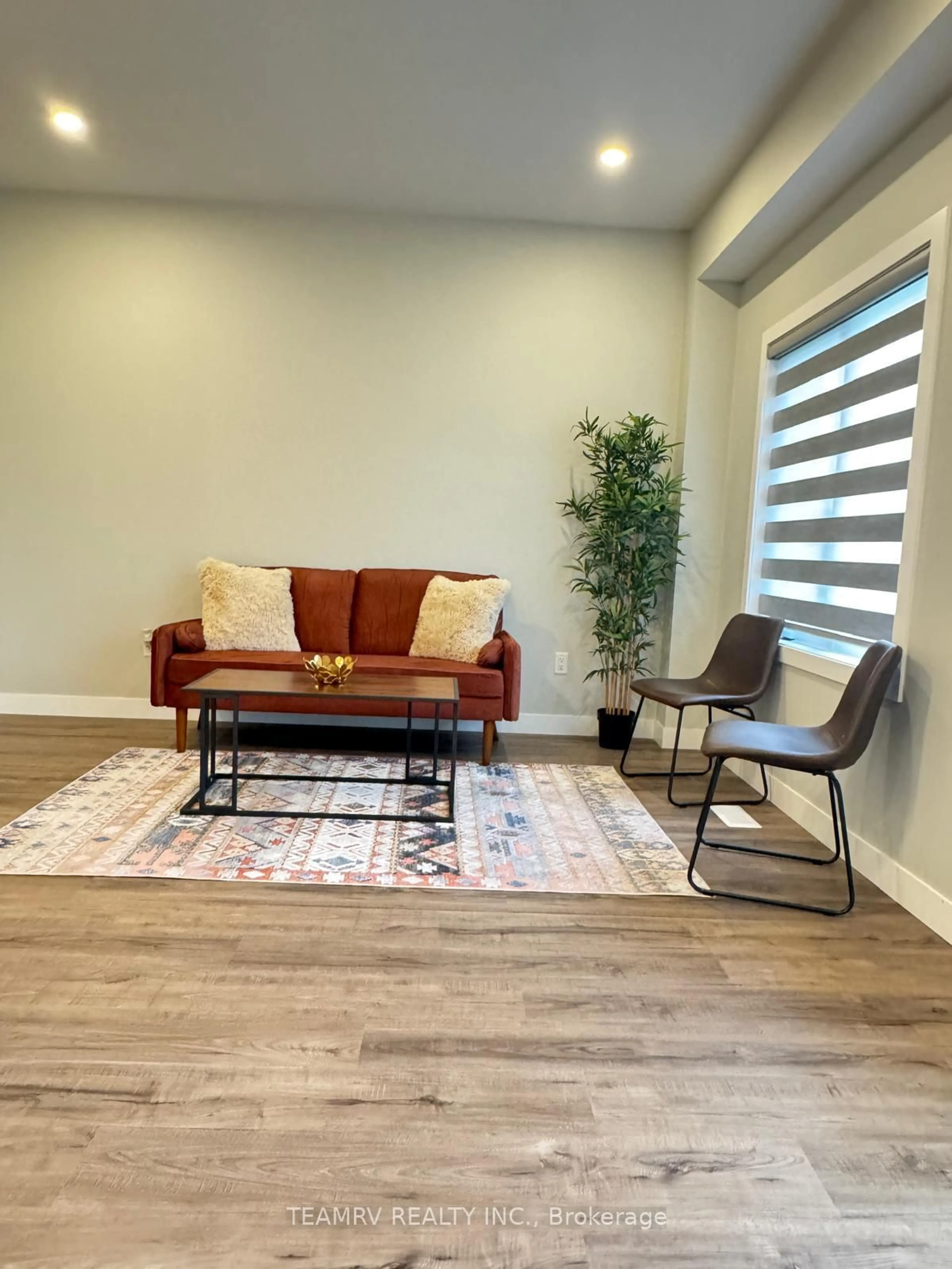 Living room with furniture, wood/laminate floor for 198 HOOPER St, St. Marys Ontario N4X 0C1