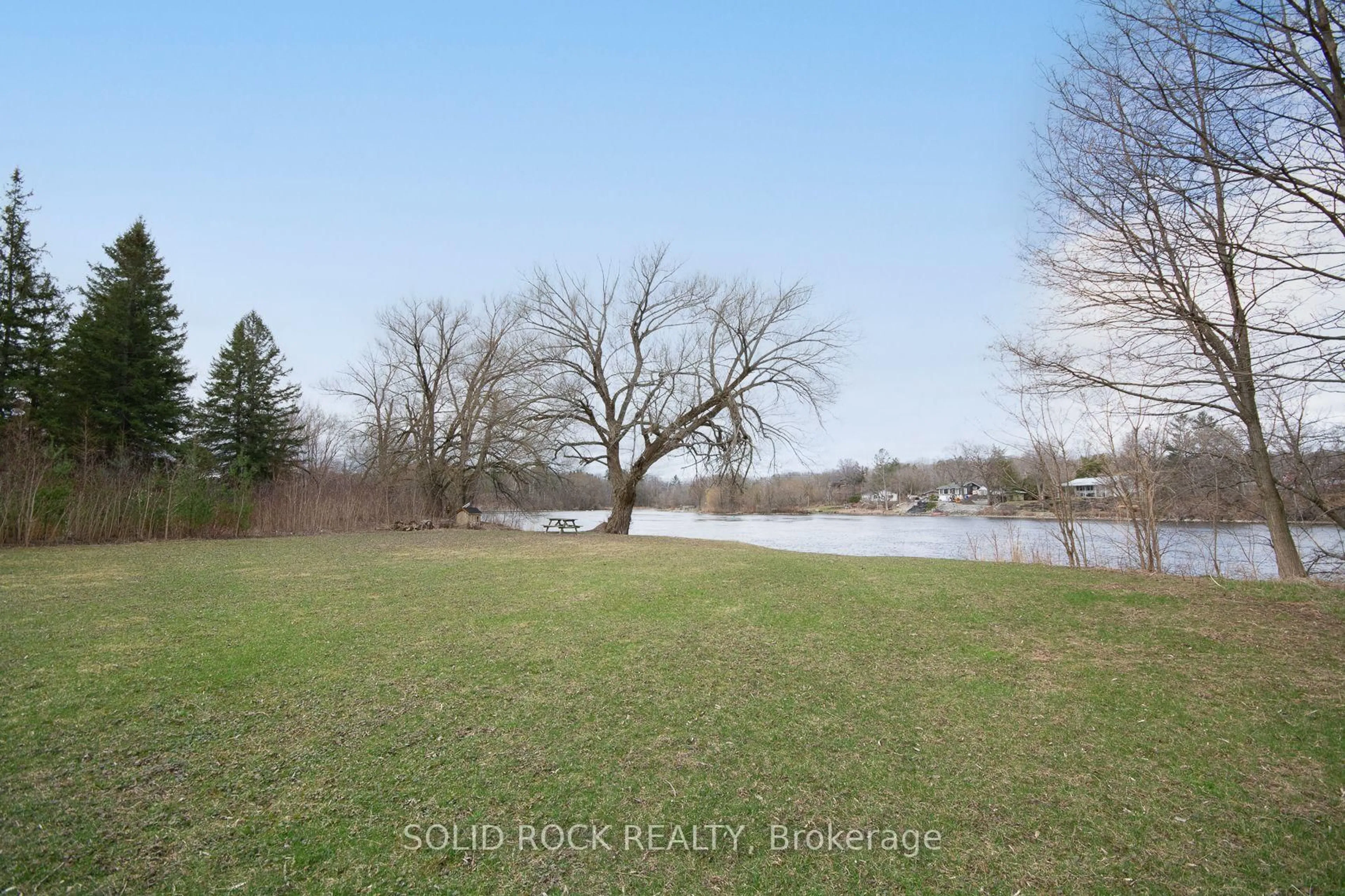A pic from outside/outdoor area/front of a property/back of a property/a pic from drone, water/lake/river/ocean view for 724 River Rd, Ottawa Ontario K4M 1B2