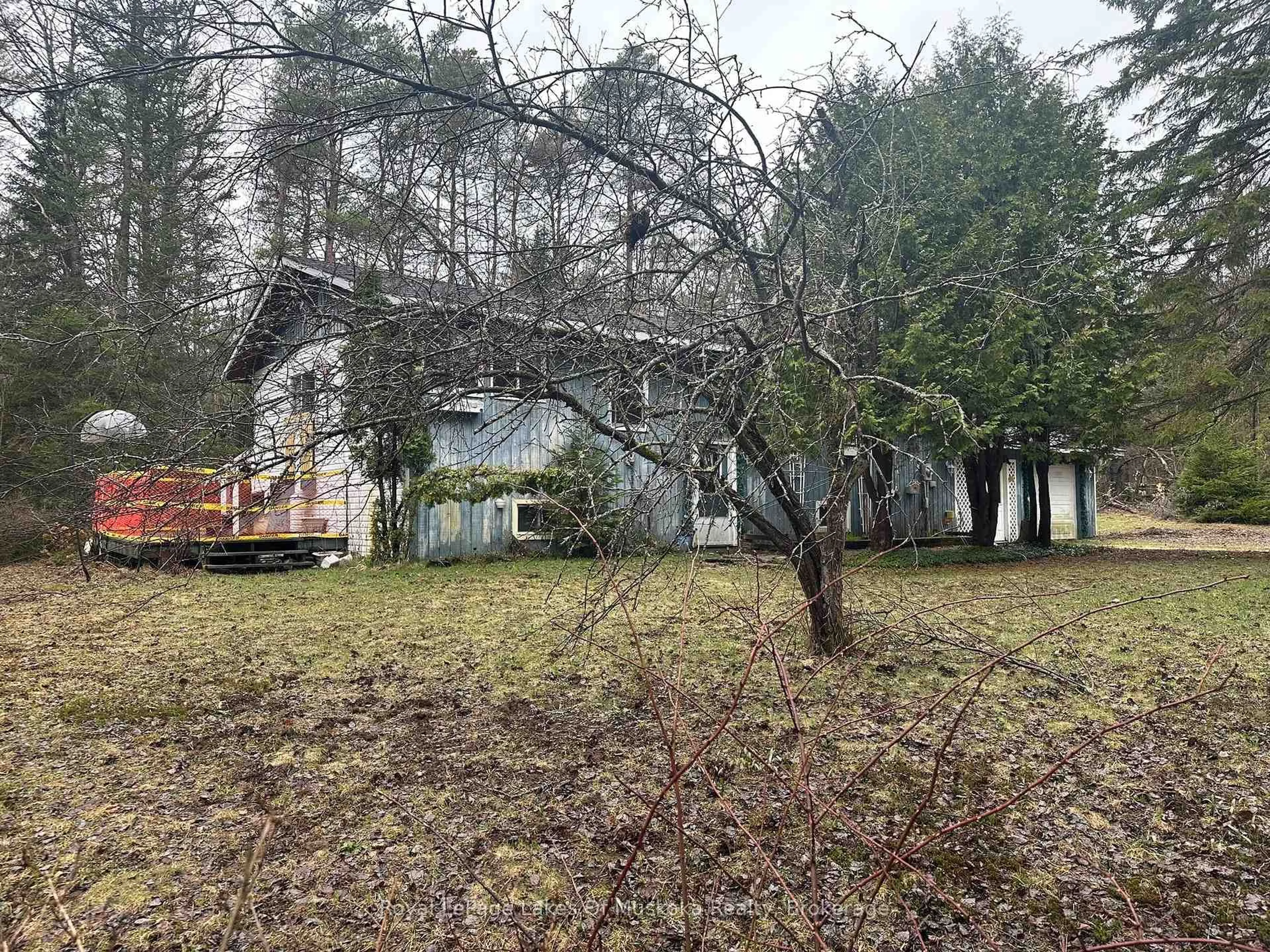 A pic from outside/outdoor area/front of a property/back of a property/a pic from drone, forest/trees view for 1326 Old North Rd, Huntsville Ontario P1H 2J4