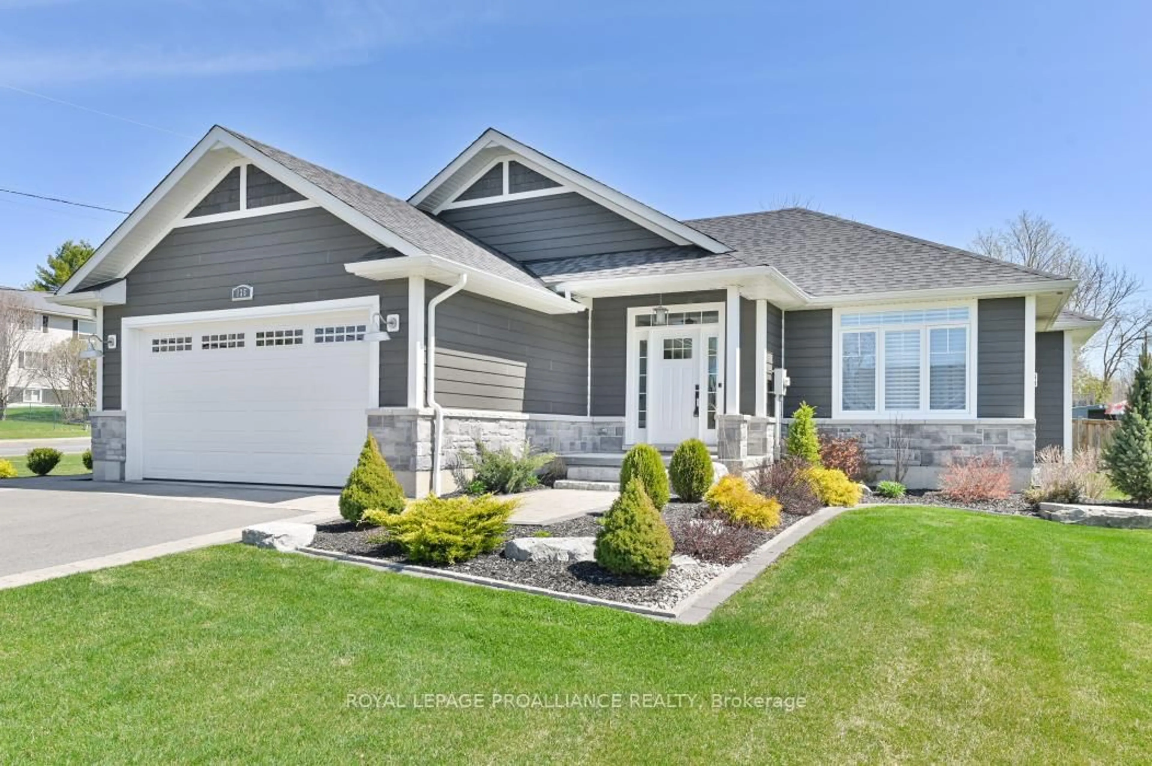 Home with vinyl exterior material, street for 135 Rollins St, Madoc Ontario K0K 2K0