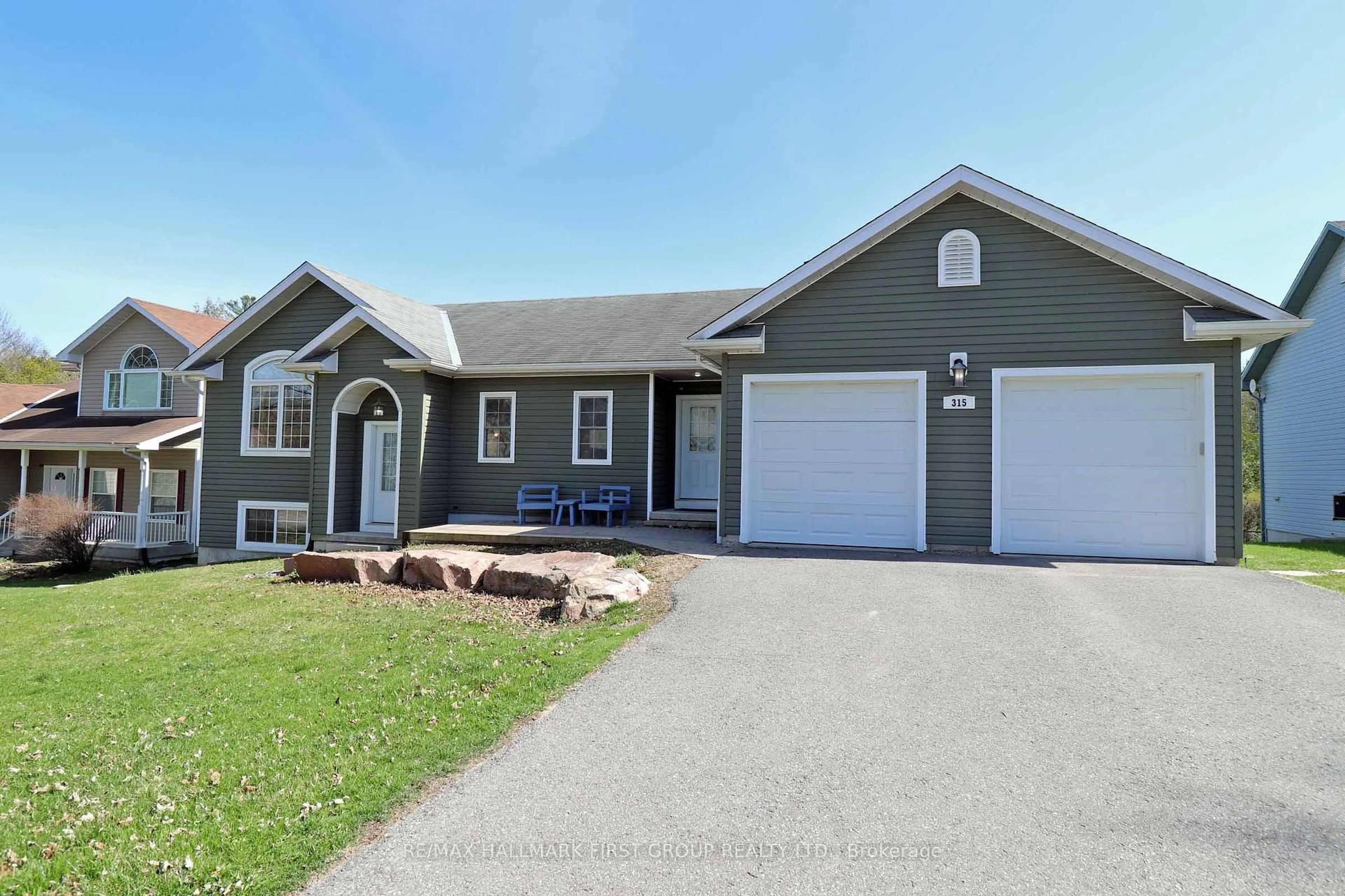 Home with vinyl exterior material, street for 315 River St, Tweed Ontario K0K 3J0