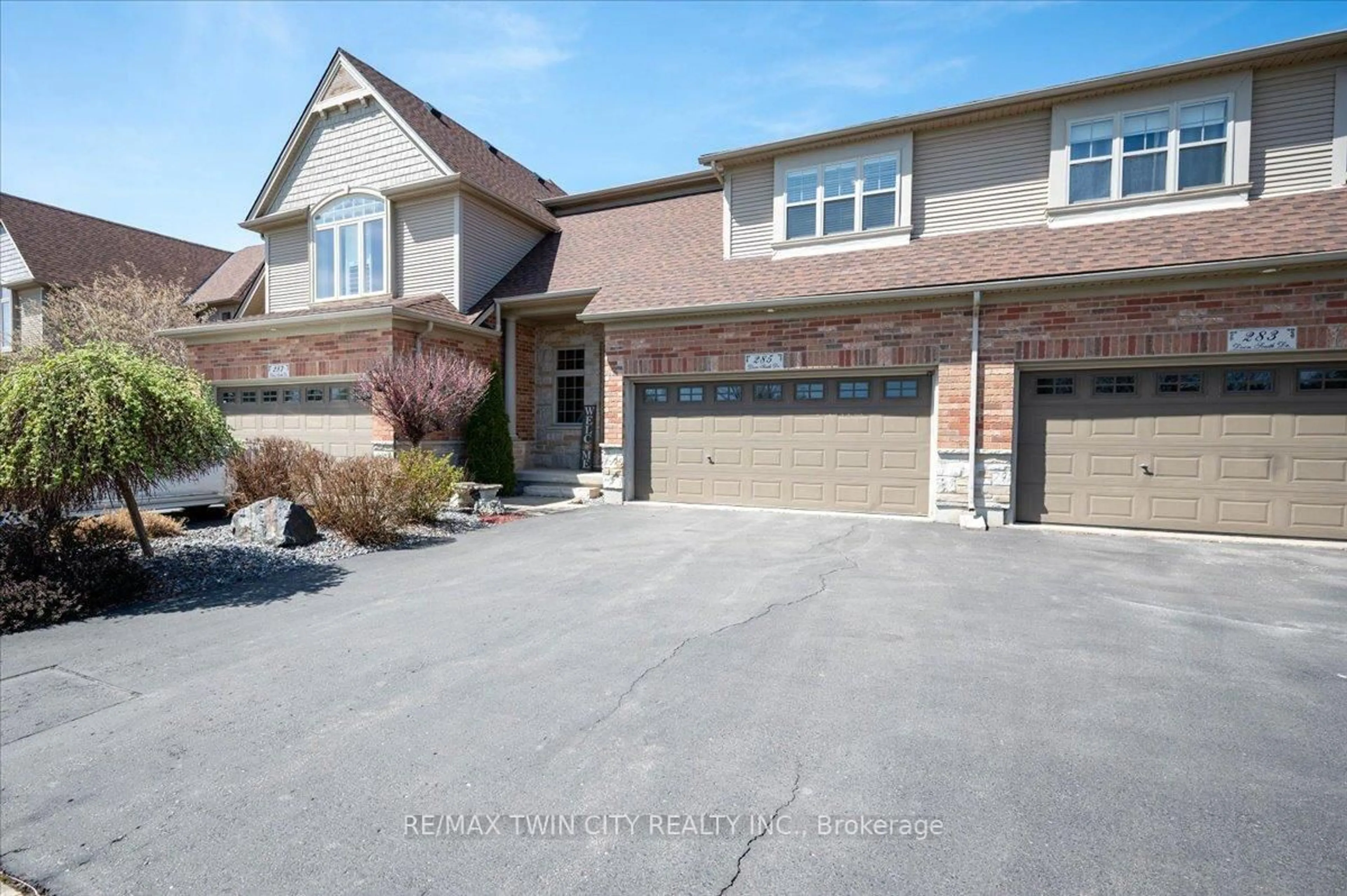 Home with brick exterior material, street for 285 Doon South Dr, Kitchener Ontario N2P 2X1