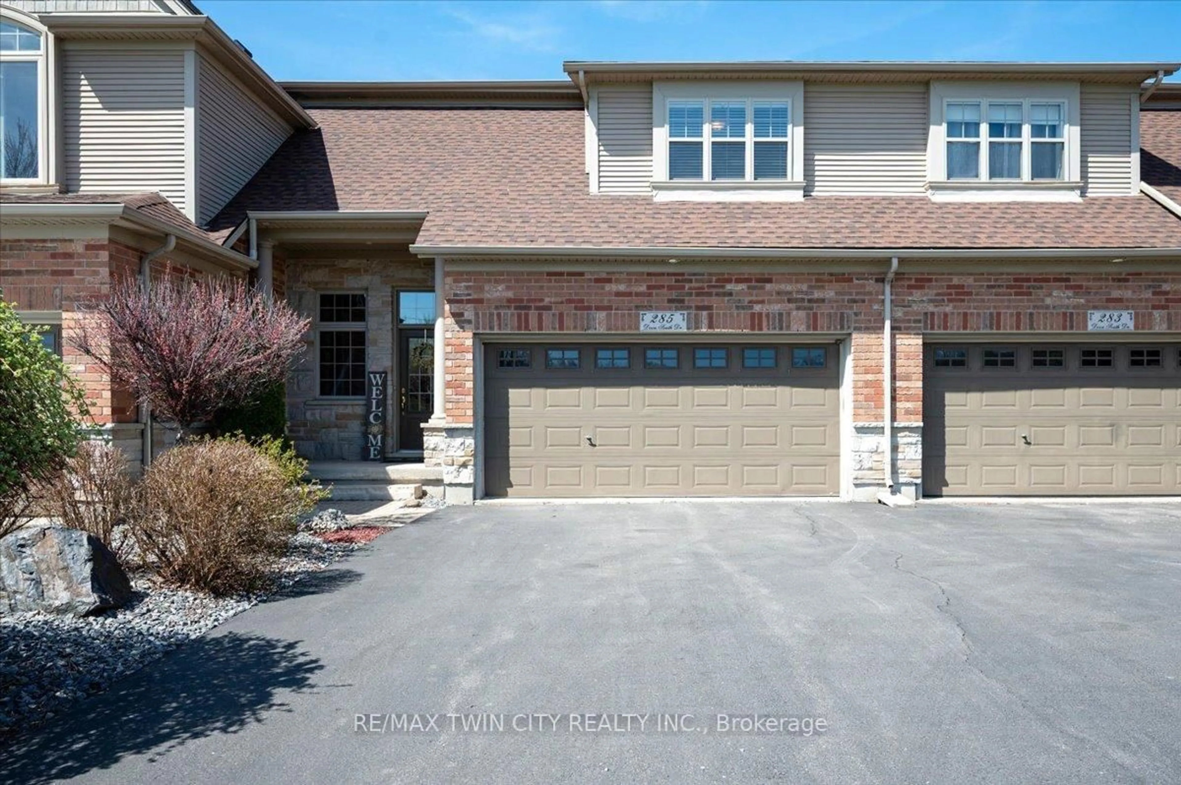 Home with brick exterior material, street for 285 Doon South Dr, Kitchener Ontario N2P 2X1