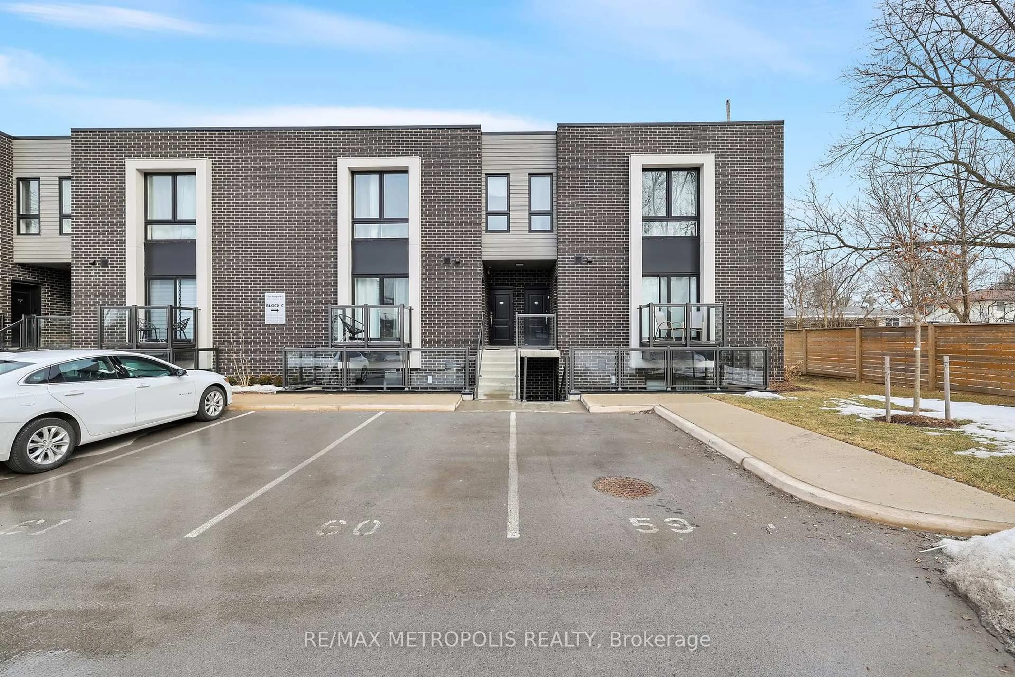 A pic from outside/outdoor area/front of a property/back of a property/a pic from drone, street for 6065 Mcleod Rd #106, Niagara Falls Ontario L2G 0Z7