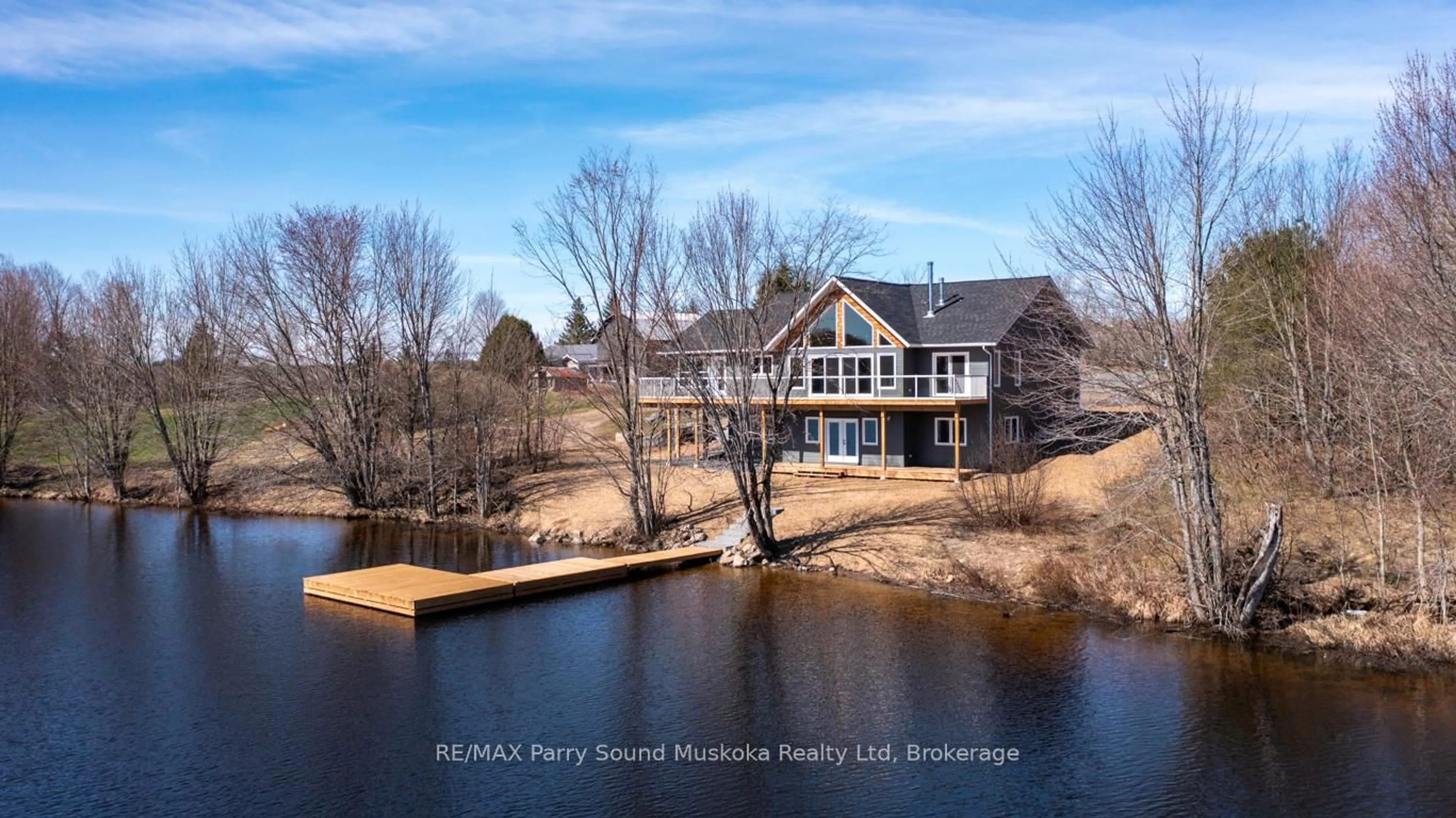 A pic from outside/outdoor area/front of a property/back of a property/a pic from drone, water/lake/river/ocean view for 49 Hardies Rd, McKellar Ontario P2A 0B5