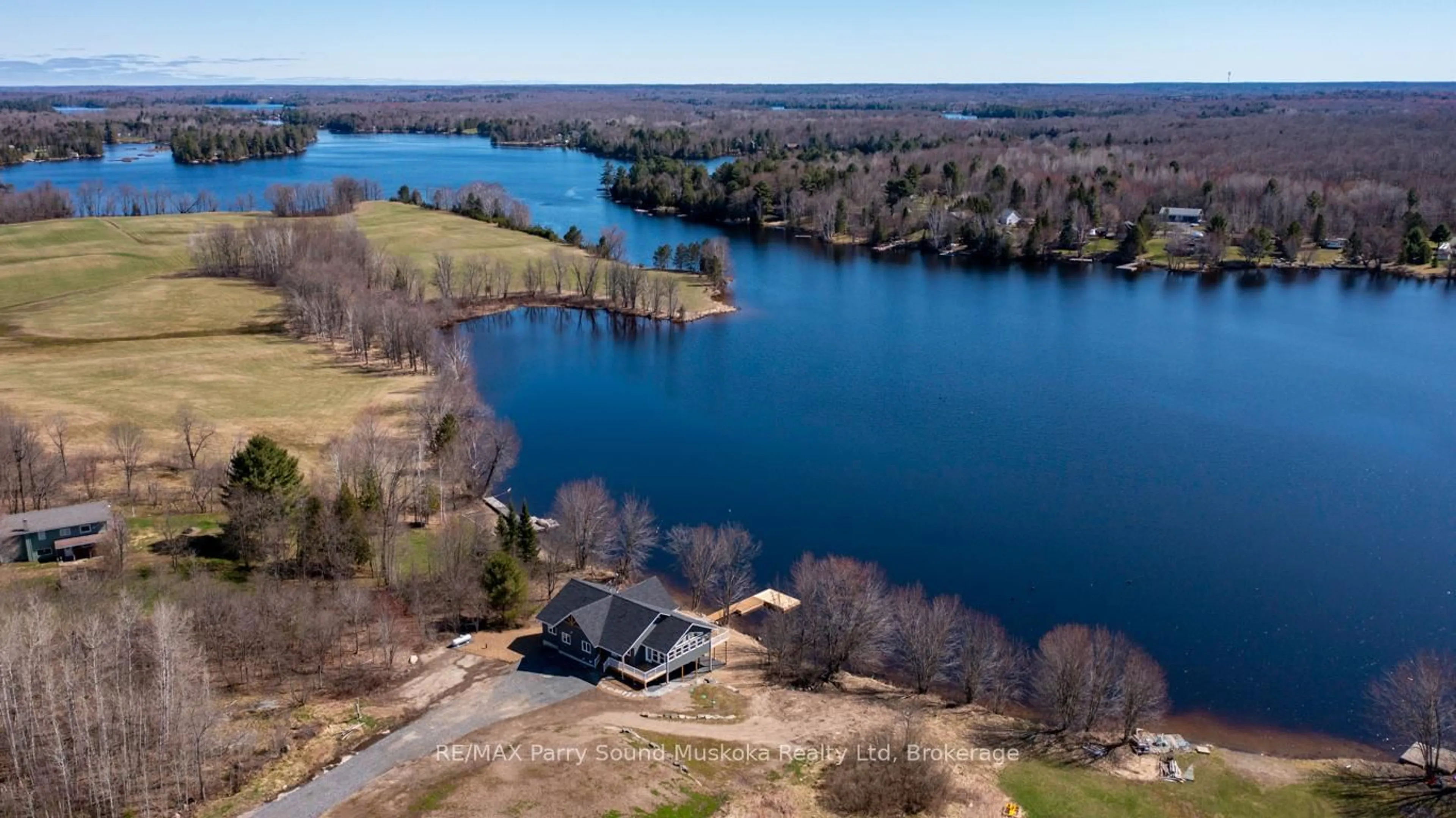 A pic from outside/outdoor area/front of a property/back of a property/a pic from drone, water/lake/river/ocean view for 49 Hardies Rd, McKellar Ontario P2A 0B5