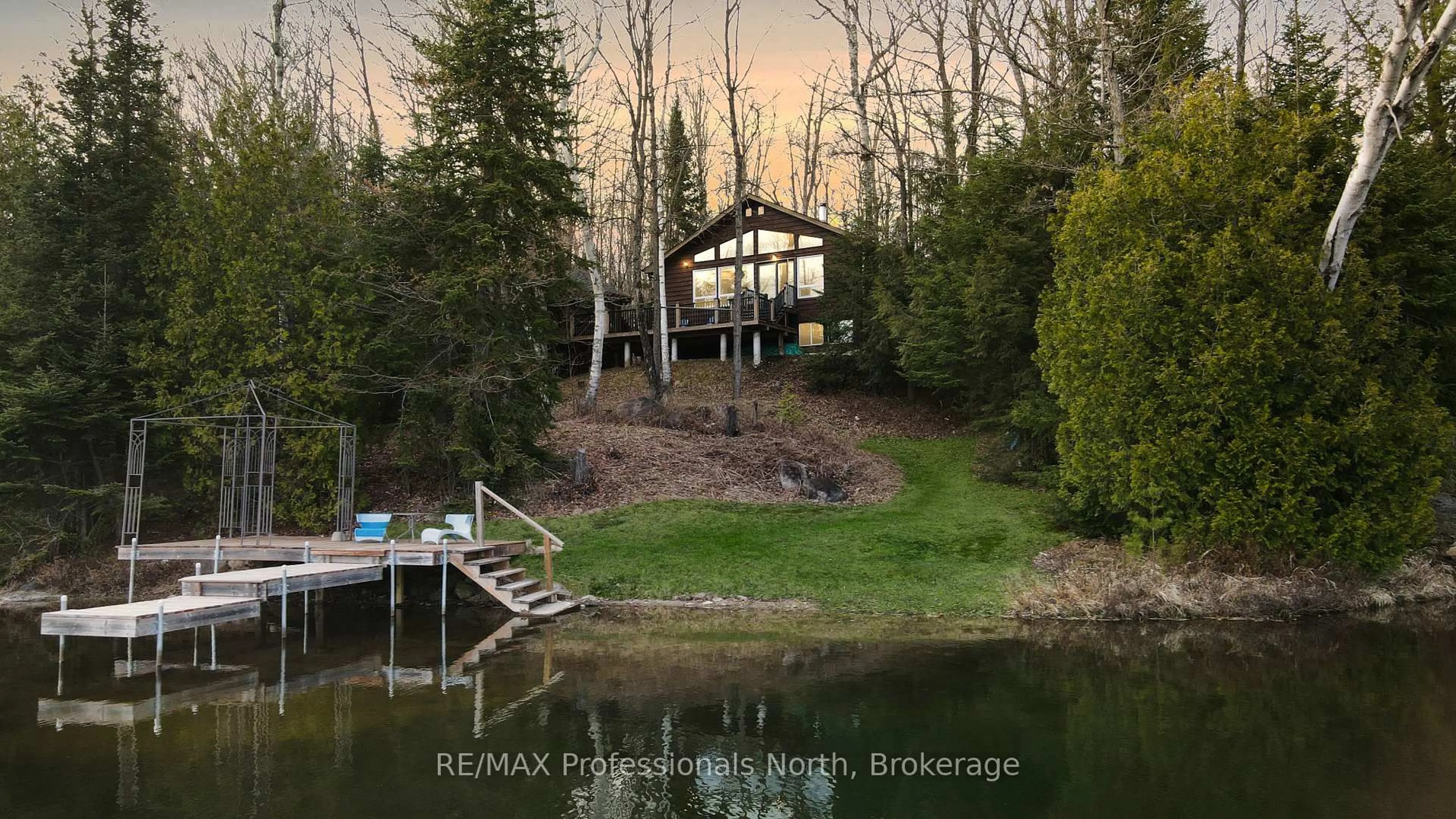 A pic from outside/outdoor area/front of a property/back of a property/a pic from drone, water/lake/river/ocean view for 1218 Waxwing Dr, Dysart et al Ontario K0L 1X0