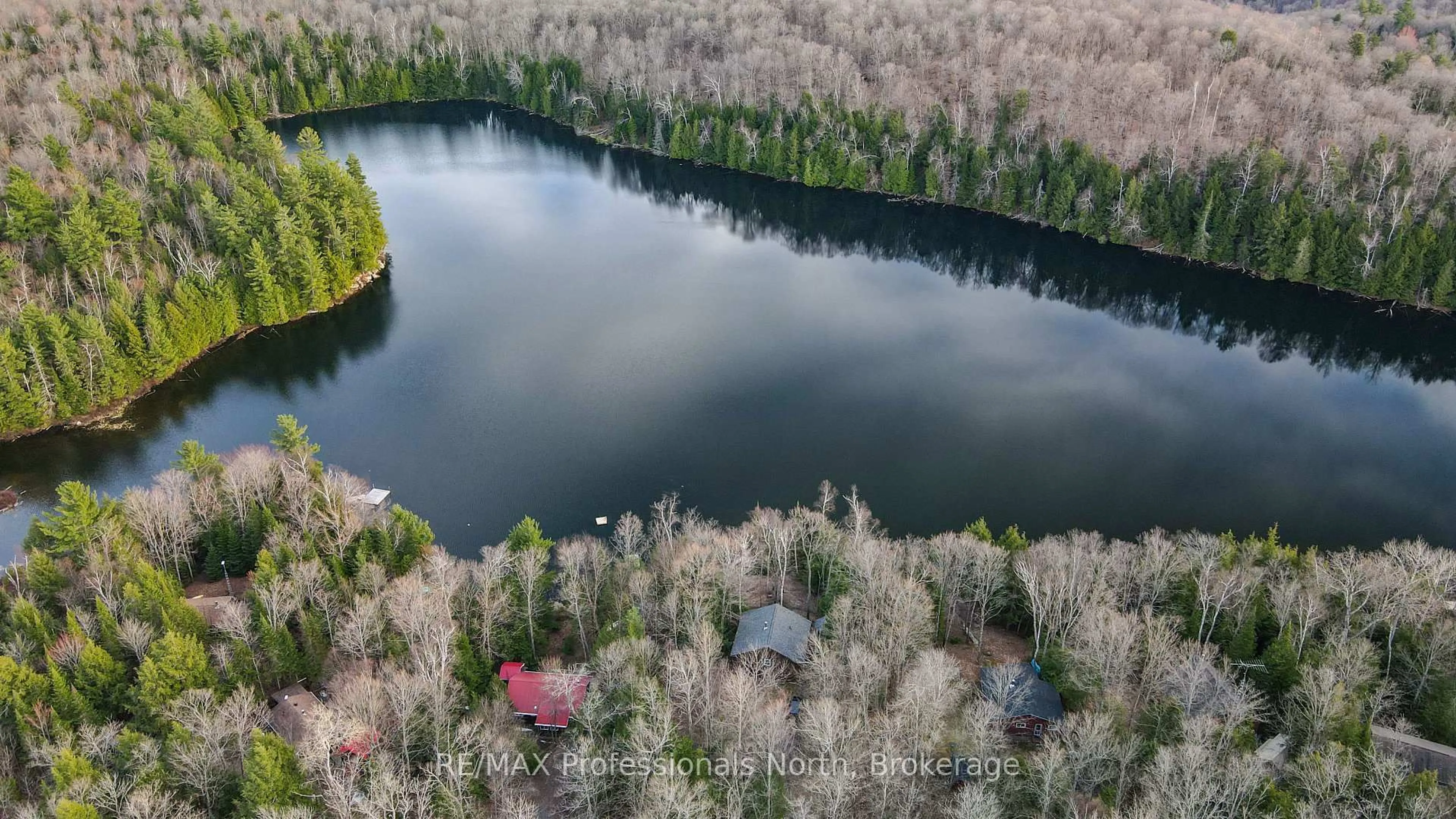 A pic from outside/outdoor area/front of a property/back of a property/a pic from drone, water/lake/river/ocean view for 1218 Waxwing Dr, Dysart et al Ontario K0L 1M1