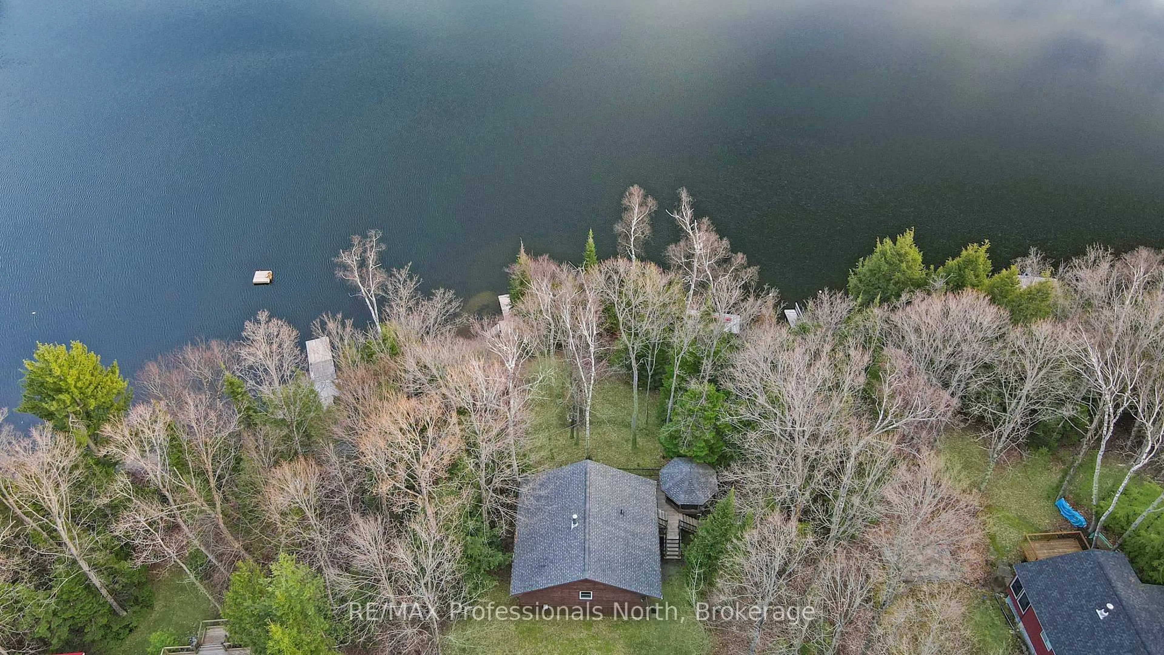 A pic from outside/outdoor area/front of a property/back of a property/a pic from drone, water/lake/river/ocean view for 1218 Waxwing Dr, Dysart et al Ontario K0L 1M1