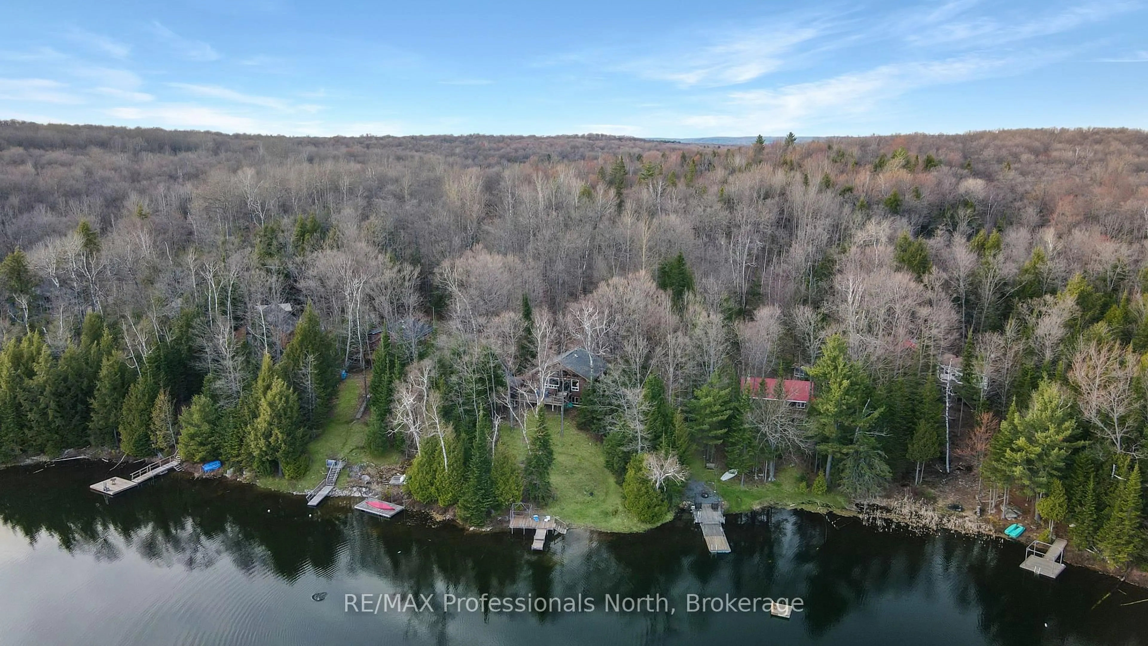 A pic from outside/outdoor area/front of a property/back of a property/a pic from drone, water/lake/river/ocean view for 1218 Waxwing Dr, Dysart et al Ontario K0L 1M1