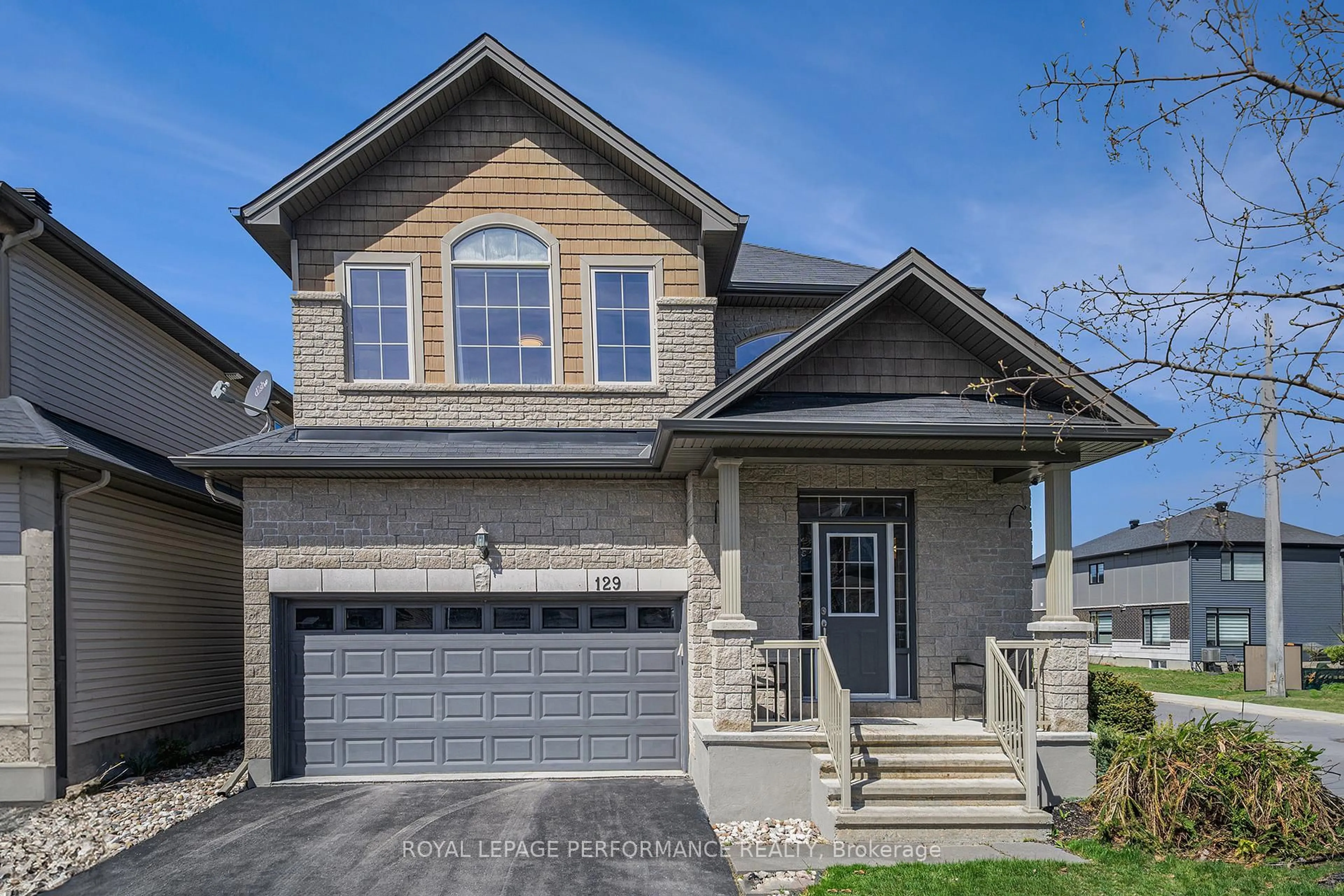 Home with brick exterior material, street for 129 Winterhaven Dr, Ottawa Ontario K1W 0H4