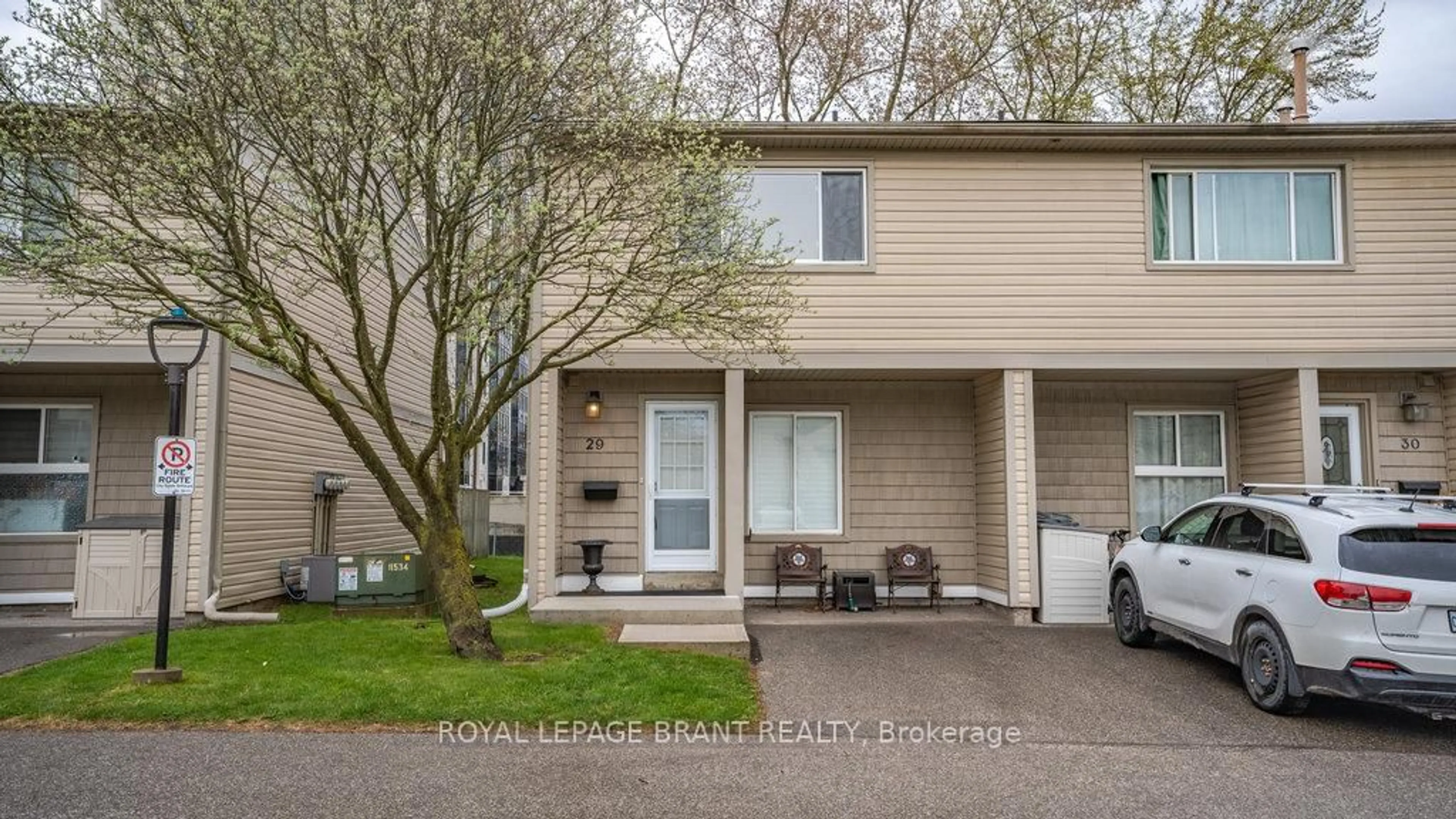 Home with vinyl exterior material, street for 15 Green Valley Dr #29, Kitchener Ontario N2P 1K7