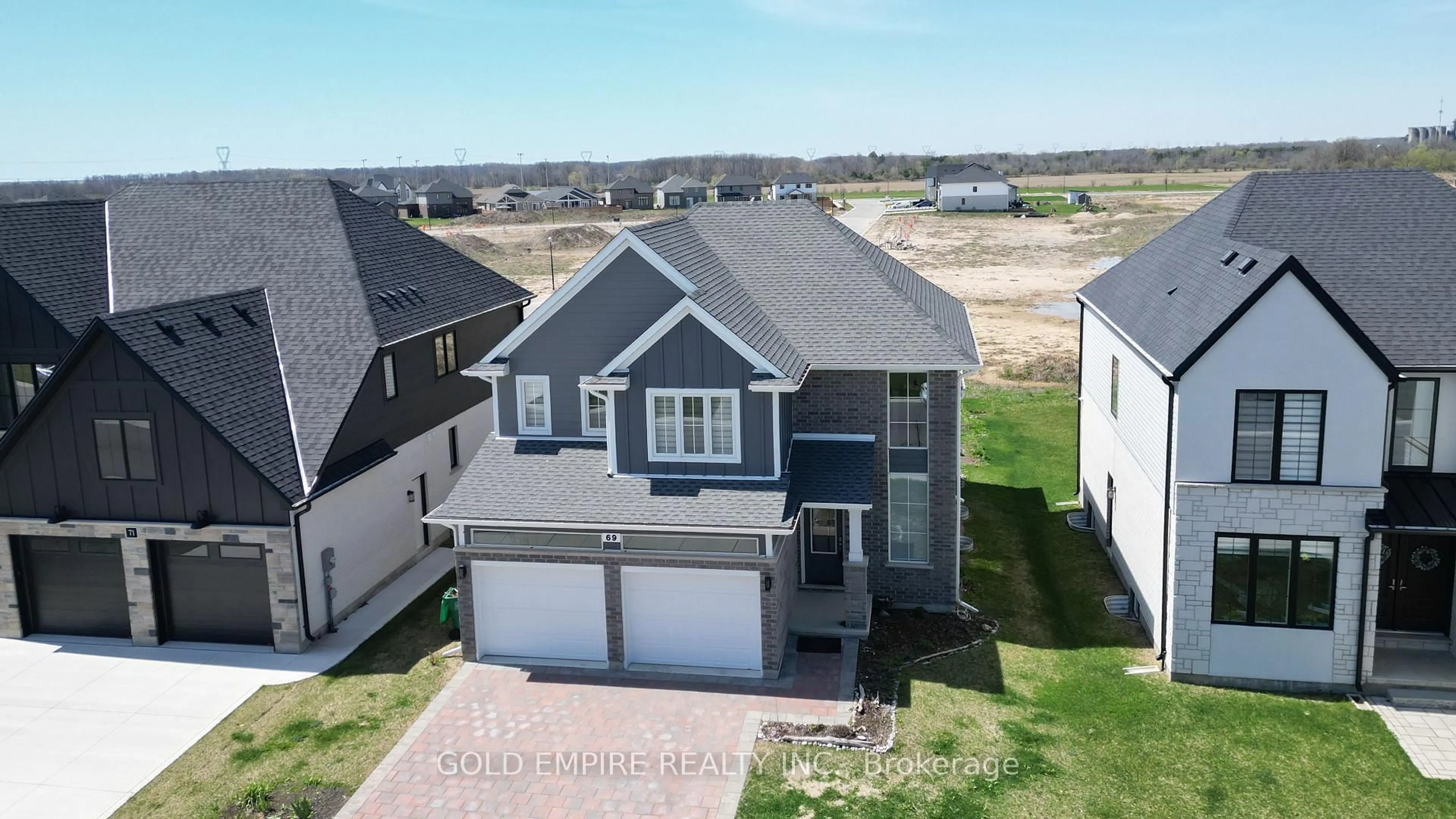 A pic from outside/outdoor area/front of a property/back of a property/a pic from drone, unknown for 69 wayside Lane, Southwold Ontario N5P 0H2