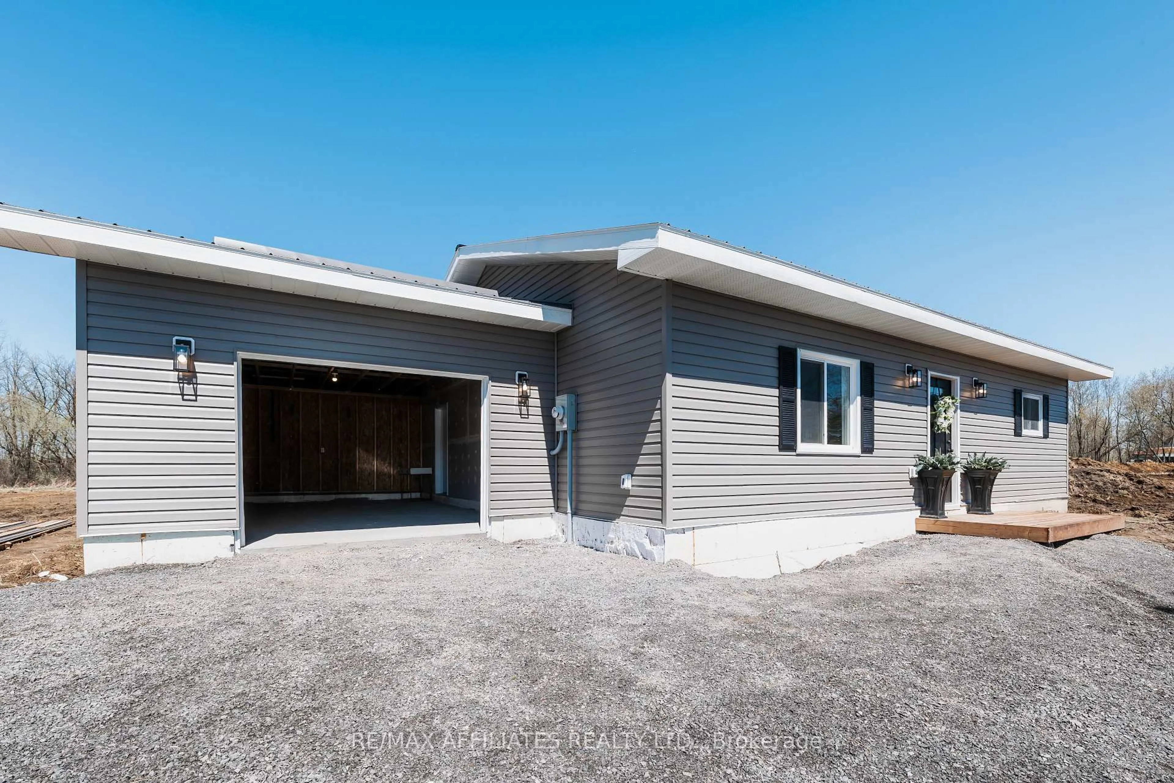 Home with vinyl exterior material, street for 10379 Hanesville Rd, South Dundas Ontario K0E 1C0