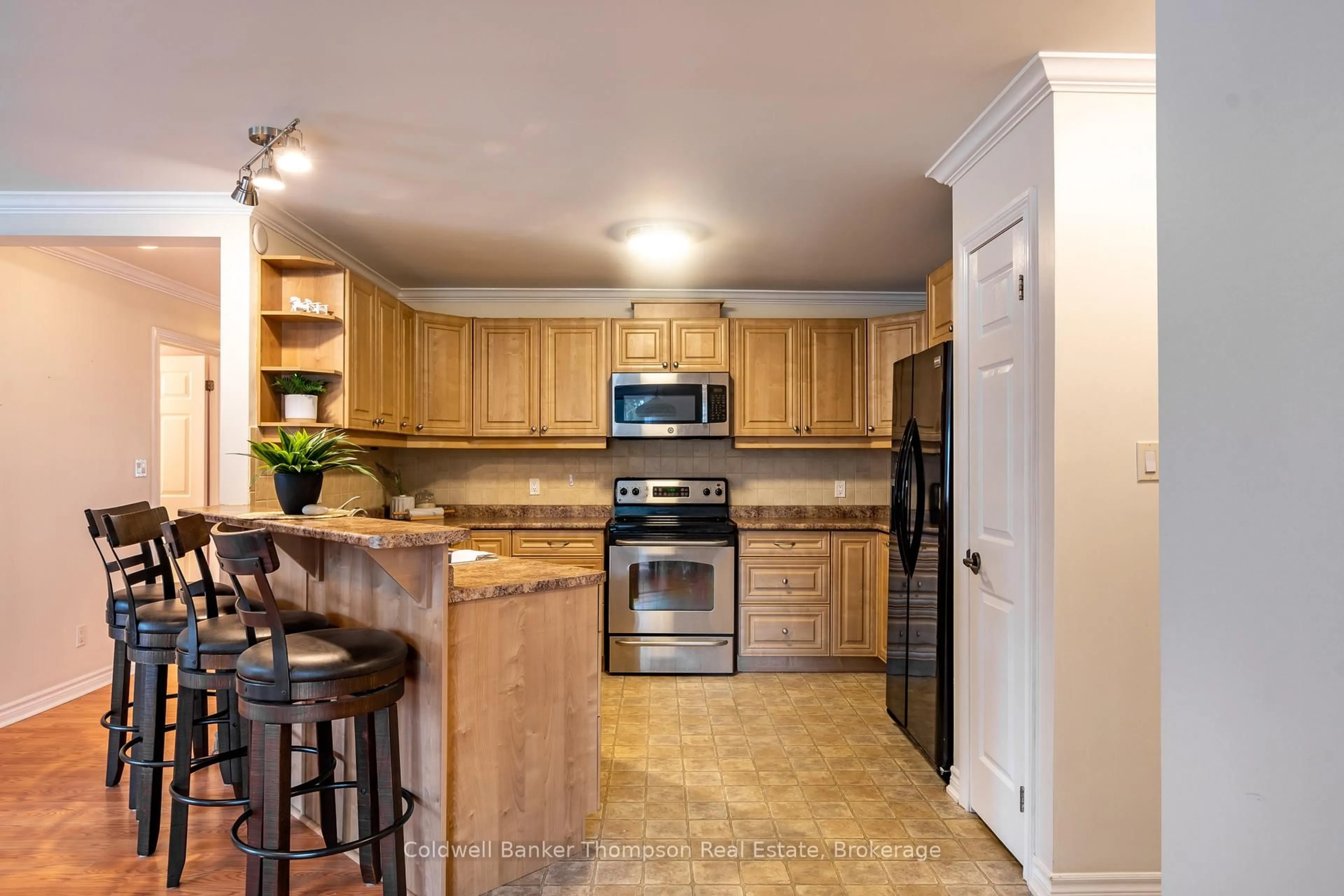 Open concept kitchen, ceramic/tile floor for 24 Dairy Lane #101, Huntsville Ontario P1H 0A4