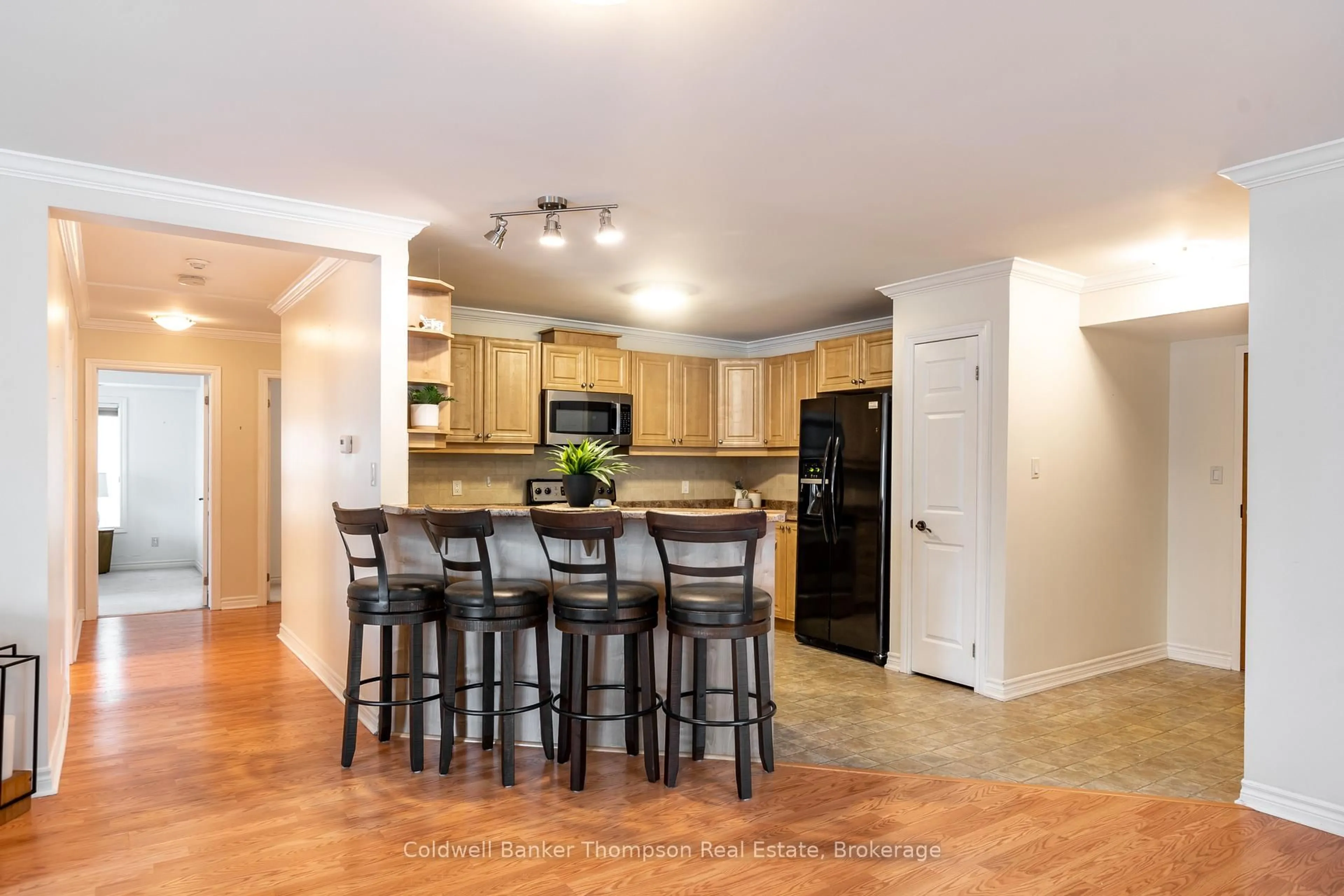 Open concept kitchen, wood/laminate floor for 24 Dairy Lane #101, Huntsville Ontario P1H 0A4