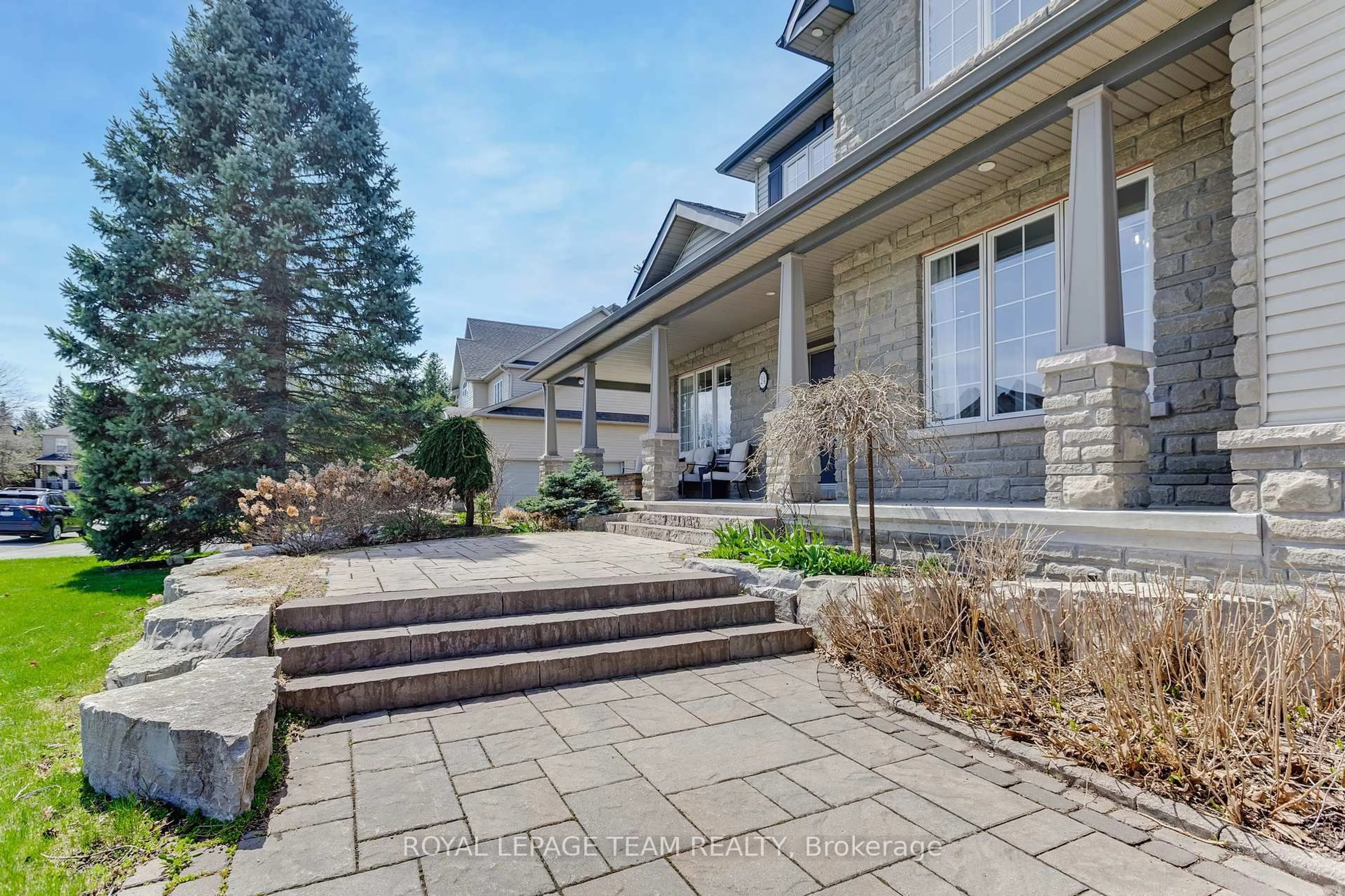Home with brick exterior material, street for 24 Cypress Garden N/A, Stittsville Ontario K2S 1W6