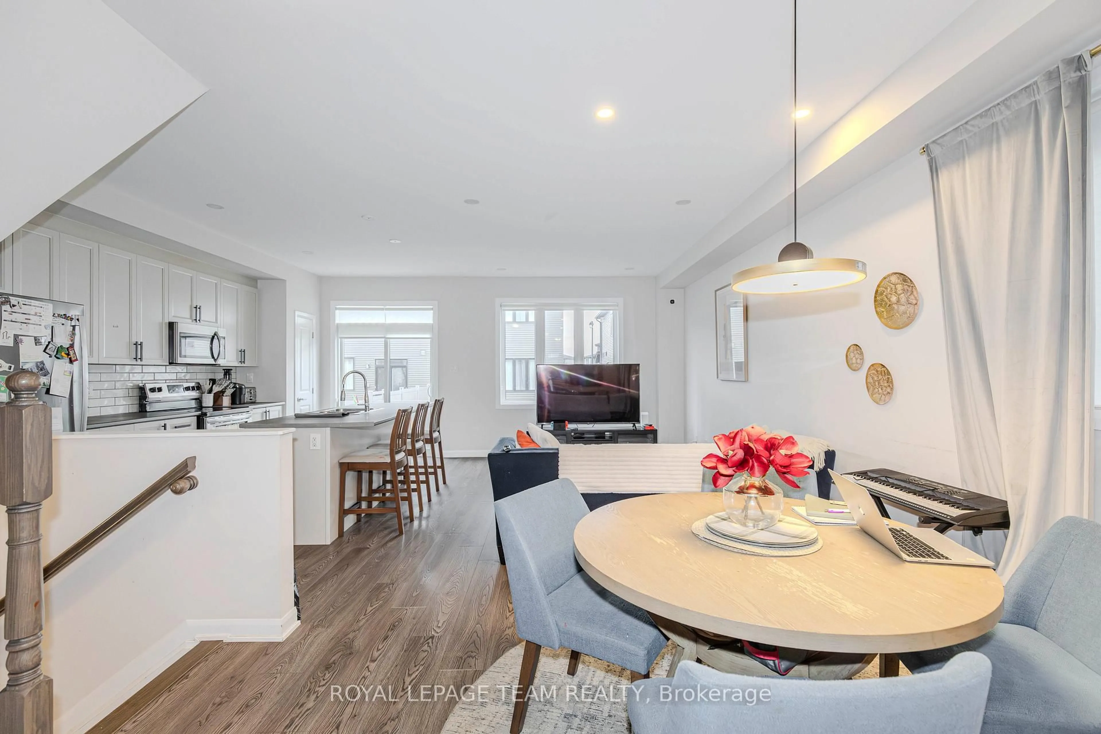 Open concept kitchen, wood/laminate floor for 2004 Caltra Cres, Ottawa Ontario K2J 6V4