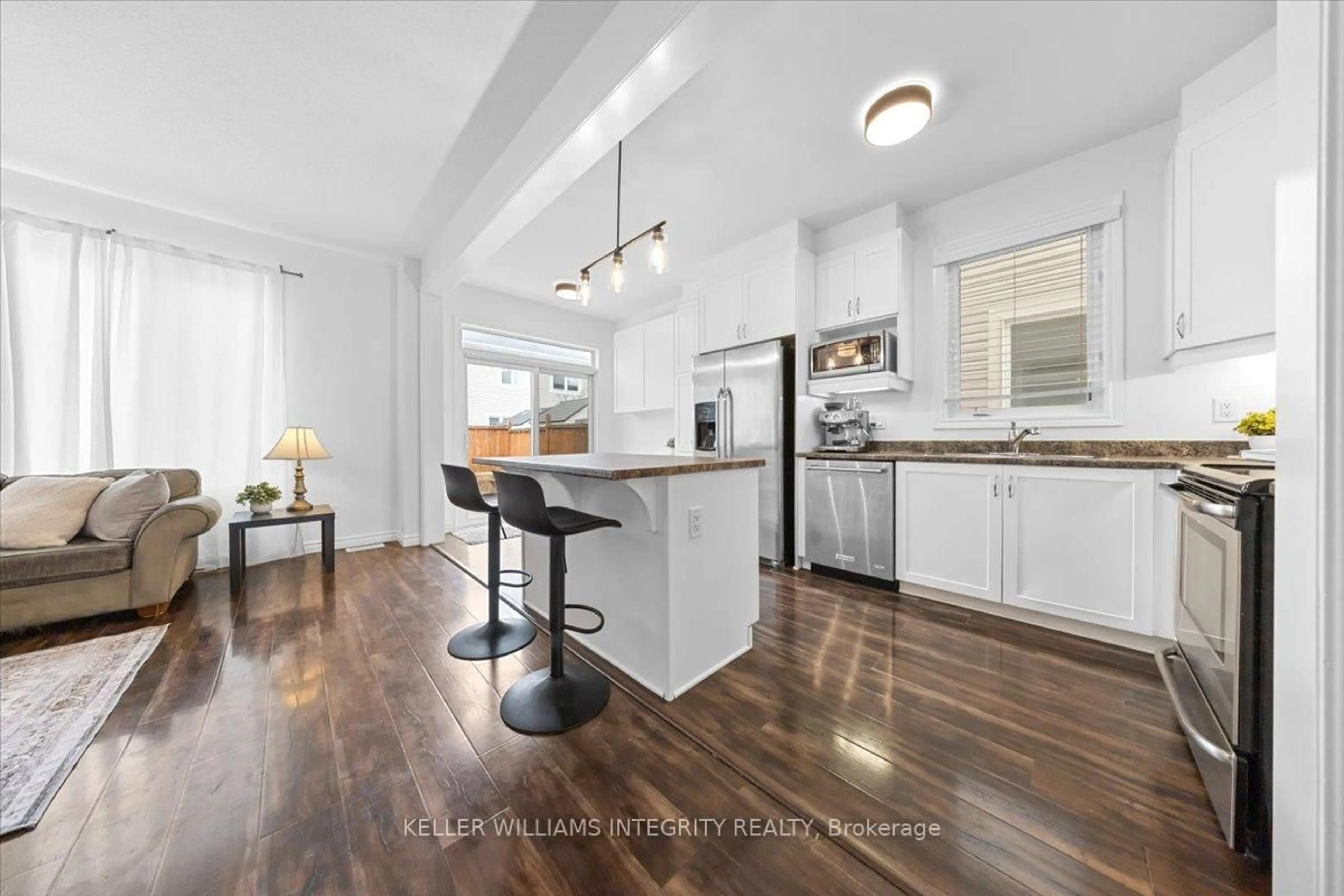 Open concept kitchen, wood/laminate floor for 542 Dundonald Dr, Ottawa Ontario K2J 5X1