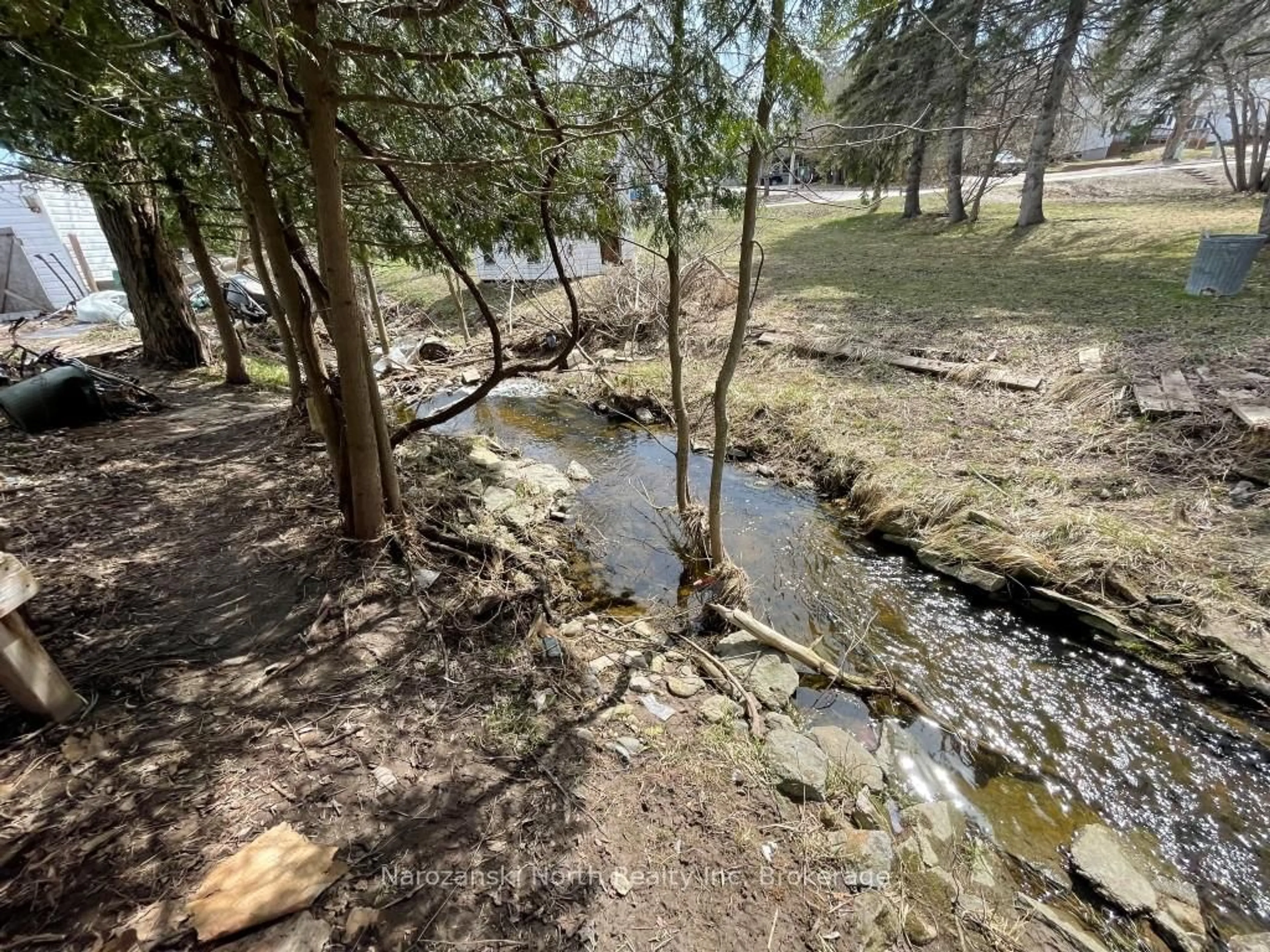 A pic from outside/outdoor area/front of a property/back of a property/a pic from drone, forest/trees view for 1 Phipps St, Gore Bay Ontario P0P 1H0