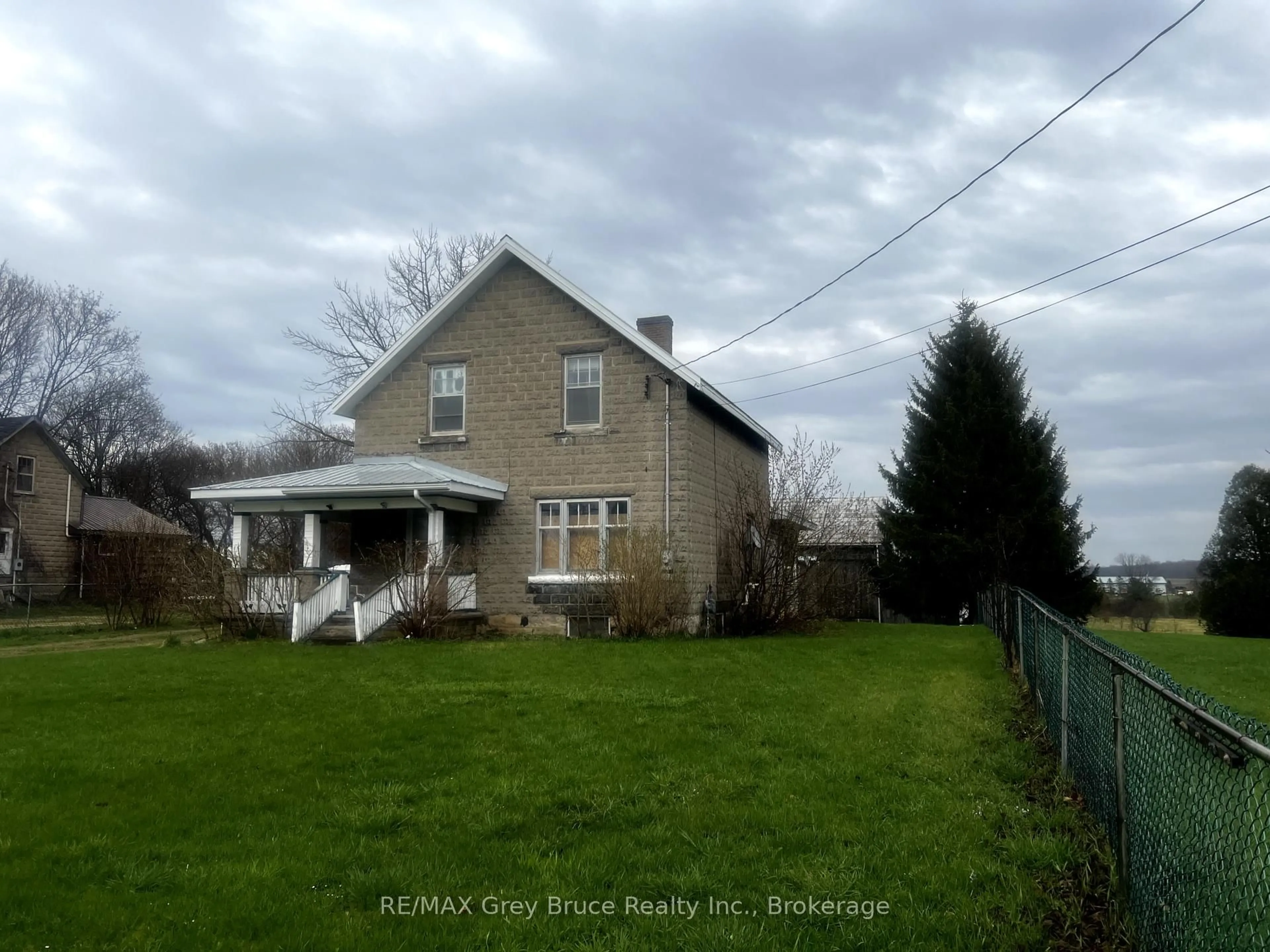 A pic from outside/outdoor area/front of a property/back of a property/a pic from drone, unknown for 10179 6 Highway, Georgian Bluffs Ontario N0H 2T0