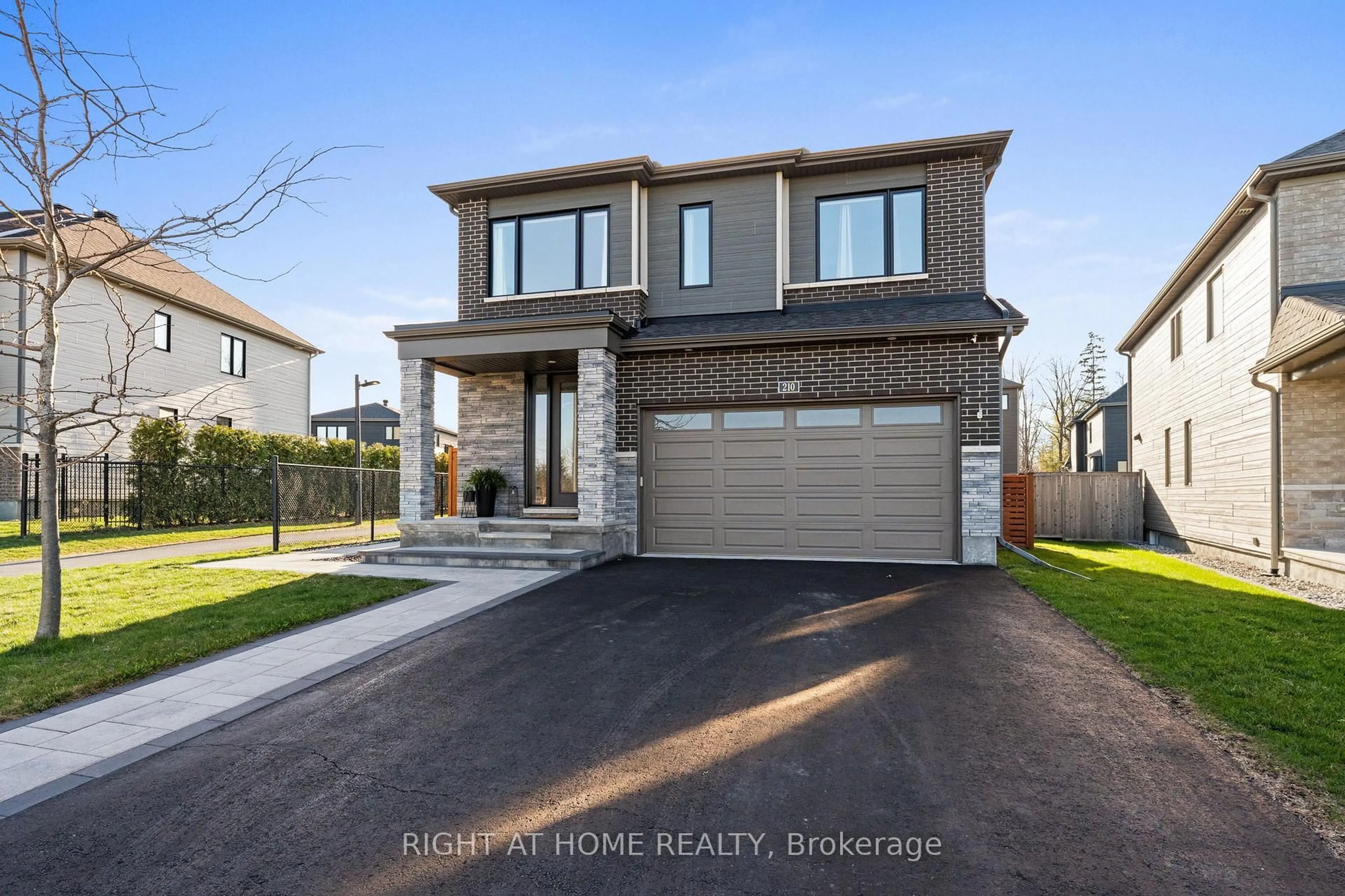 Home with brick exterior material, street for 210 Spindrift Circ, Manotick Ontario K4M 1J8