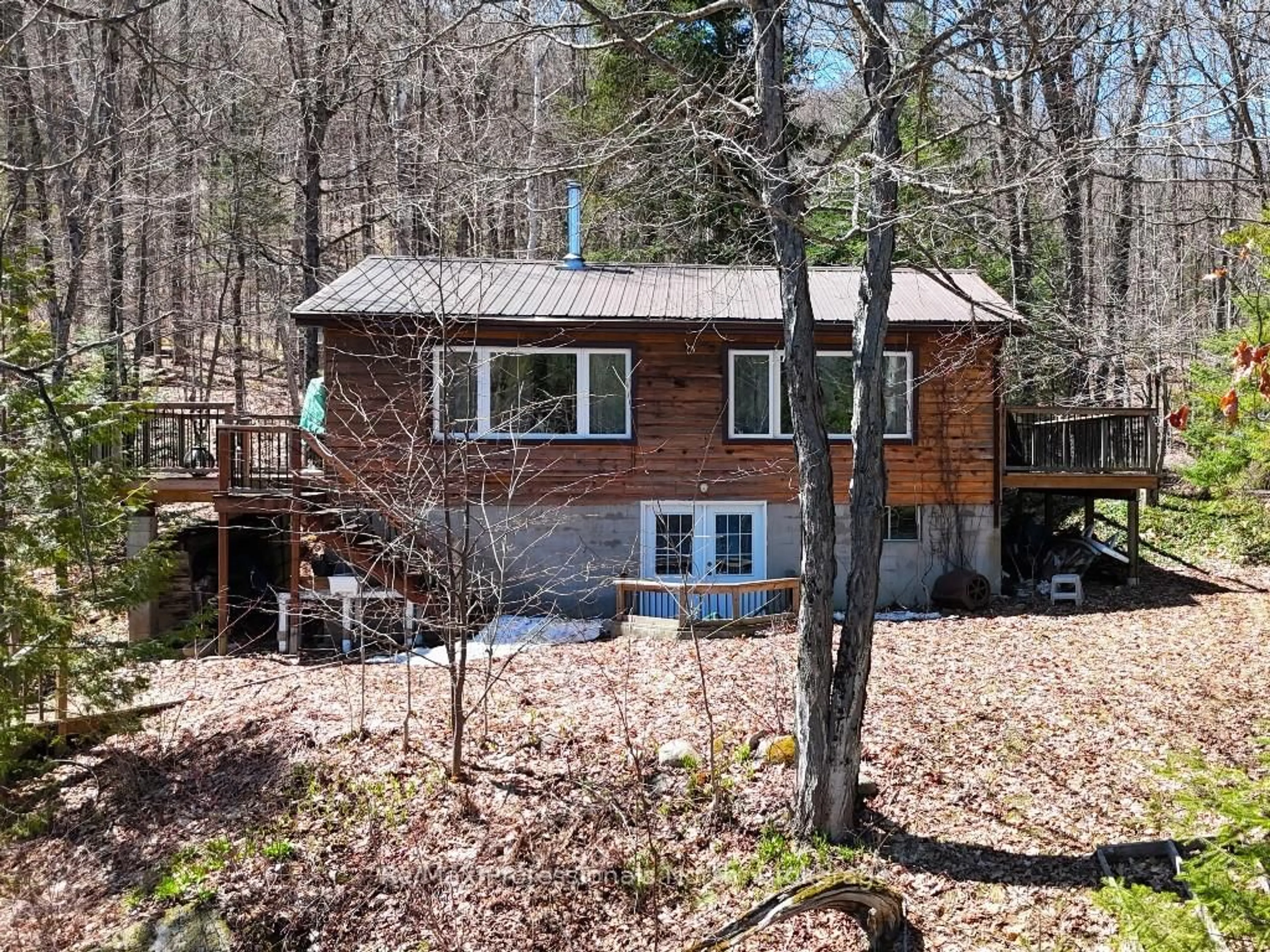 A pic from outside/outdoor area/front of a property/back of a property/a pic from drone, forest/trees view for 1063 Esson Creek Lane, Highlands East Ontario K0L 3C0