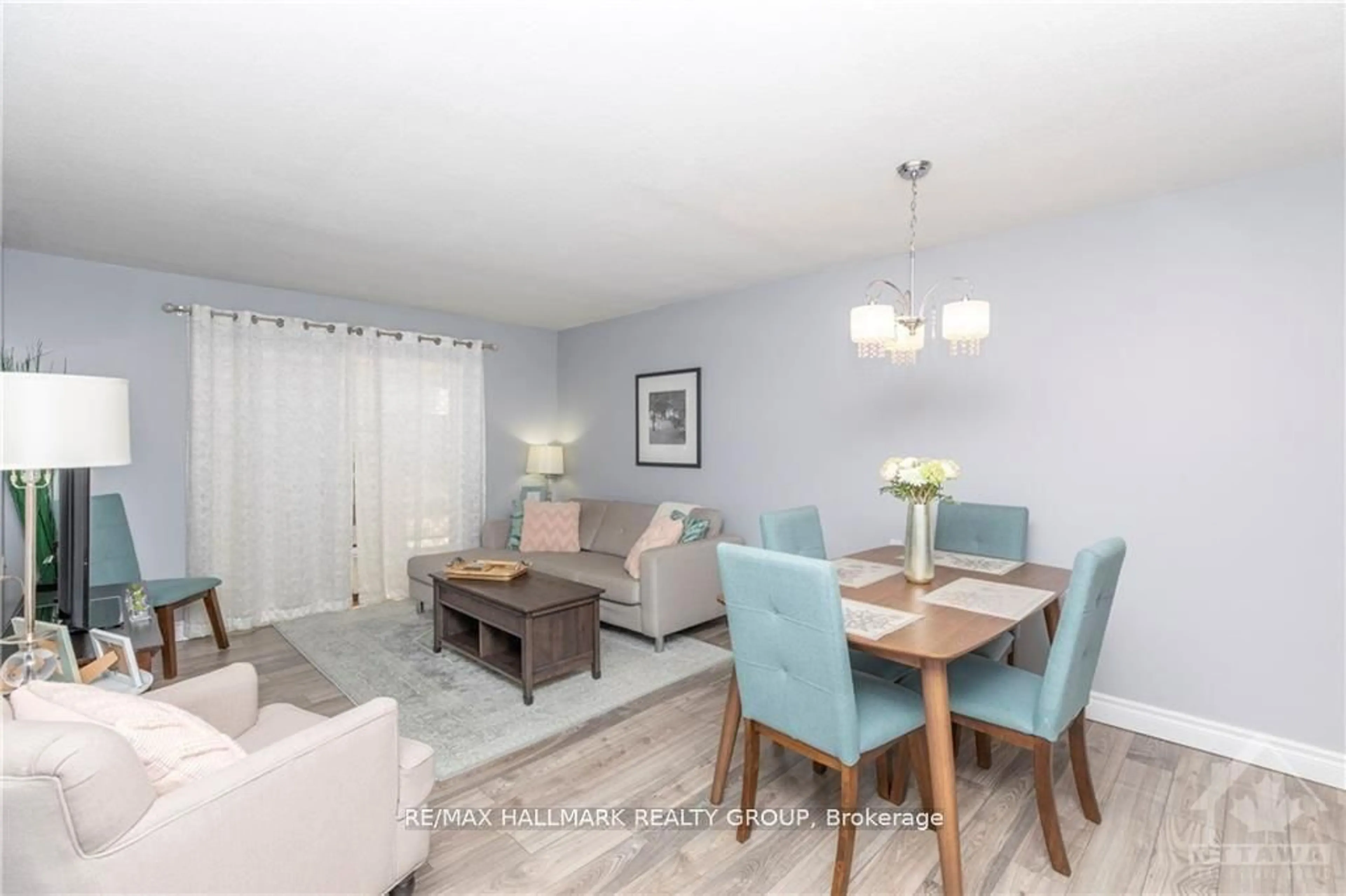 Living room with furniture, wood/laminate floor for 475 Laurier Ave #205, Ottawa Ontario K1R 7X1