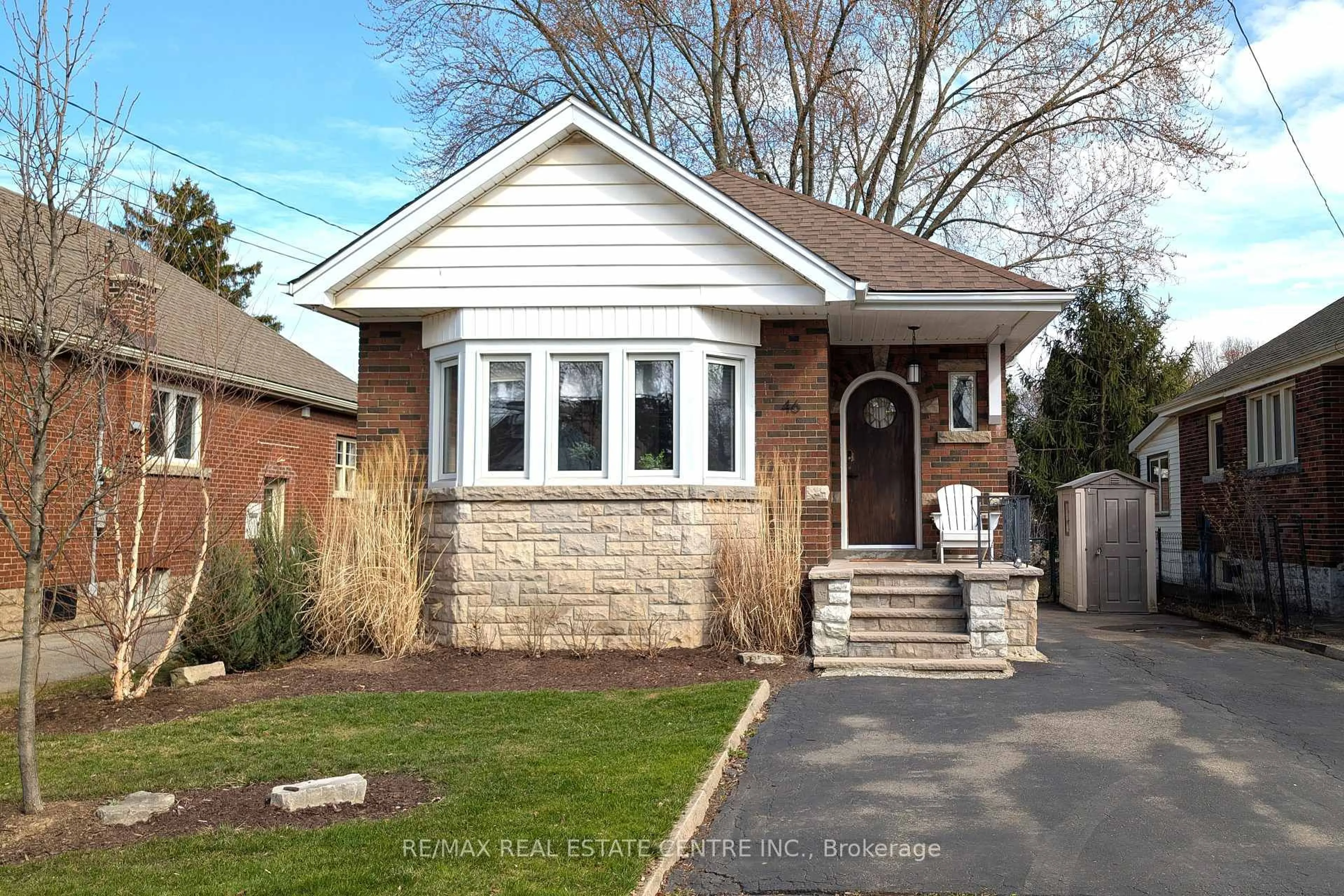 Home with brick exterior material, street for 46 Kenmore Rd, Hamilton Ontario L8S 3T7