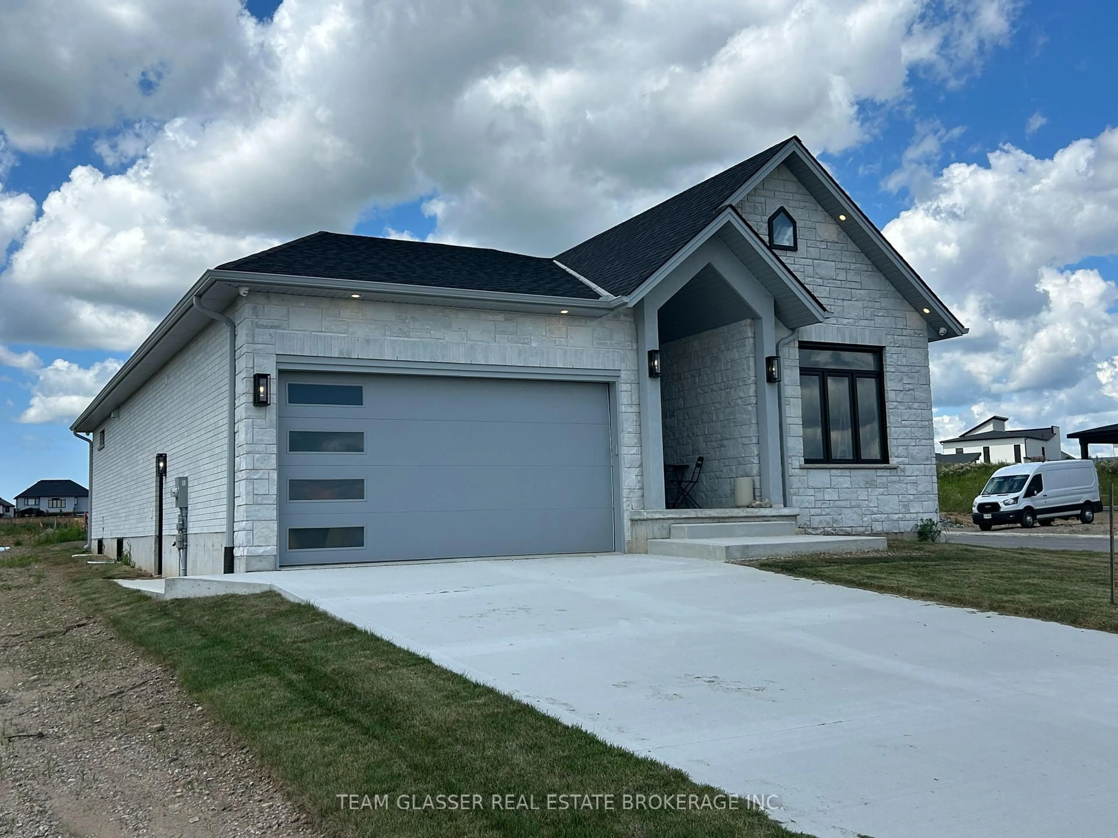 Home with vinyl exterior material, street for 70 Benner Blvd #Lot 94, Middlesex Centre Ontario N0L 1R0