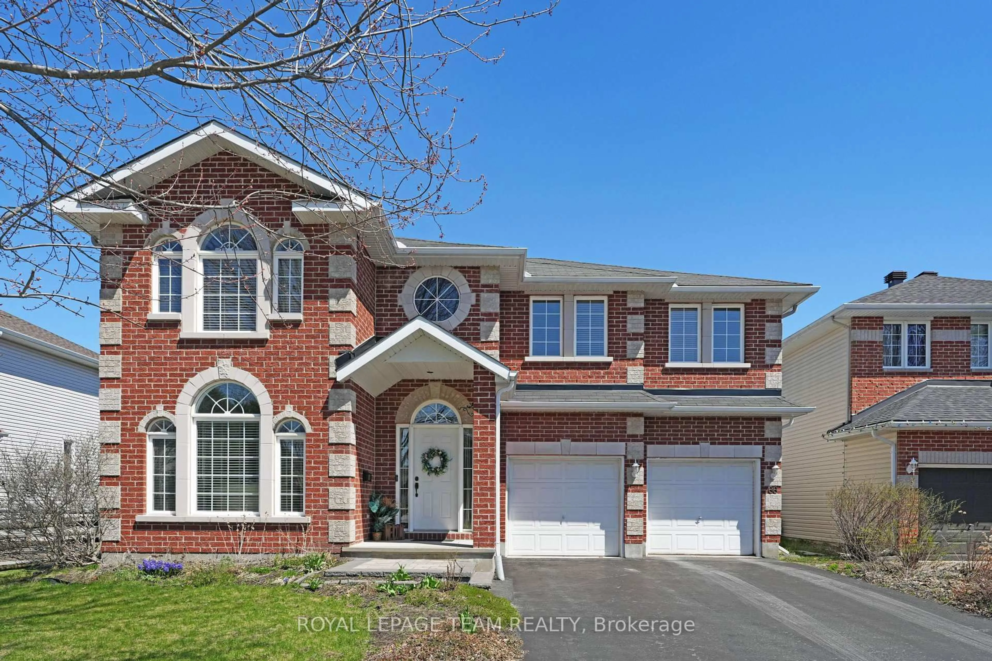 Home with brick exterior material, street for 66 Woliston Cres, Ottawa Ontario K2W 1E5