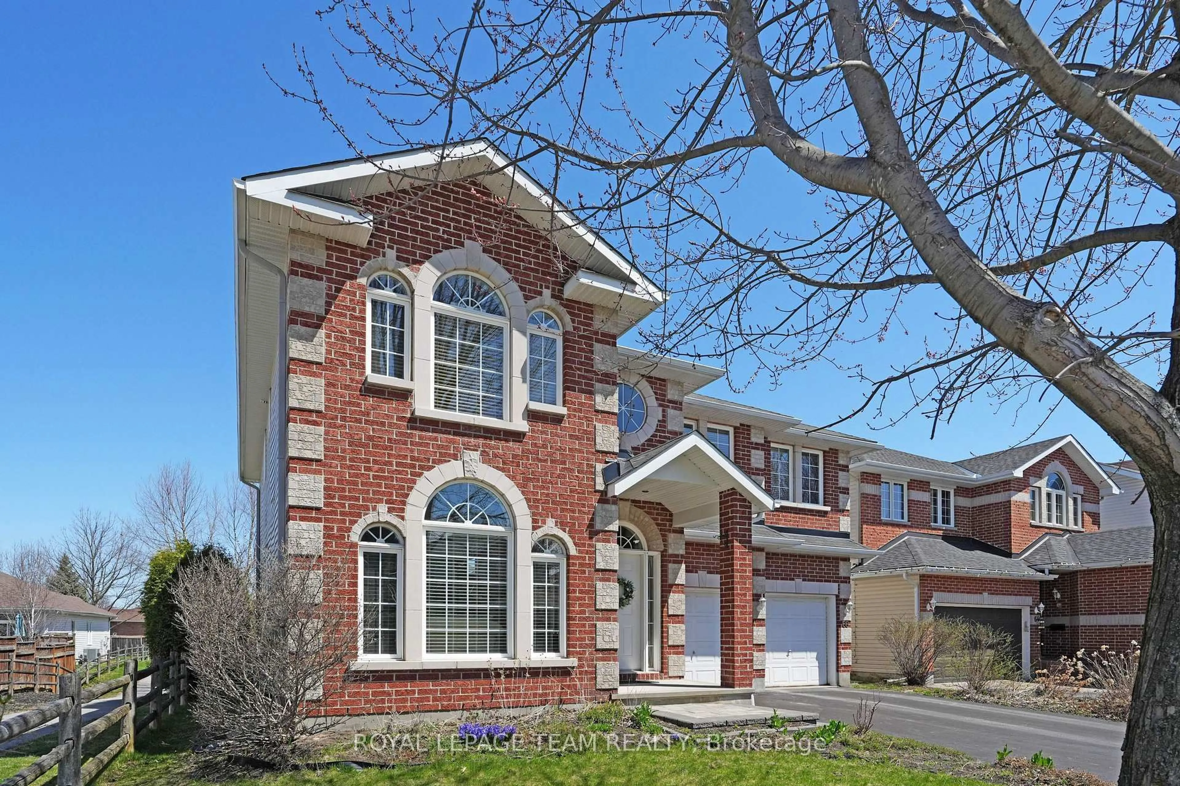 Home with brick exterior material, street for 66 Woliston Cres, Ottawa Ontario K2W 1E5