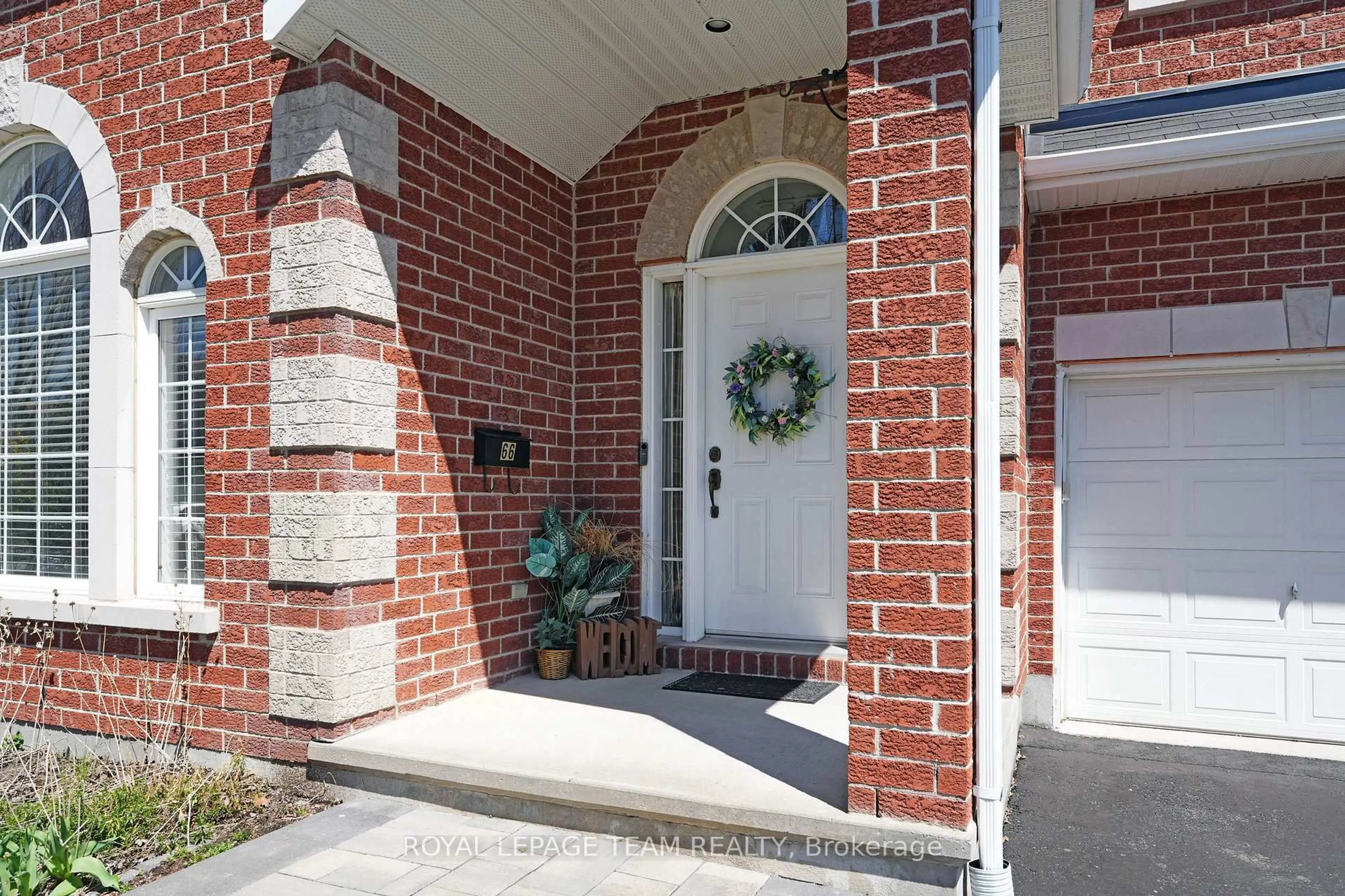 Home with brick exterior material, street for 66 Woliston Cres, Ottawa Ontario K2W 1E5