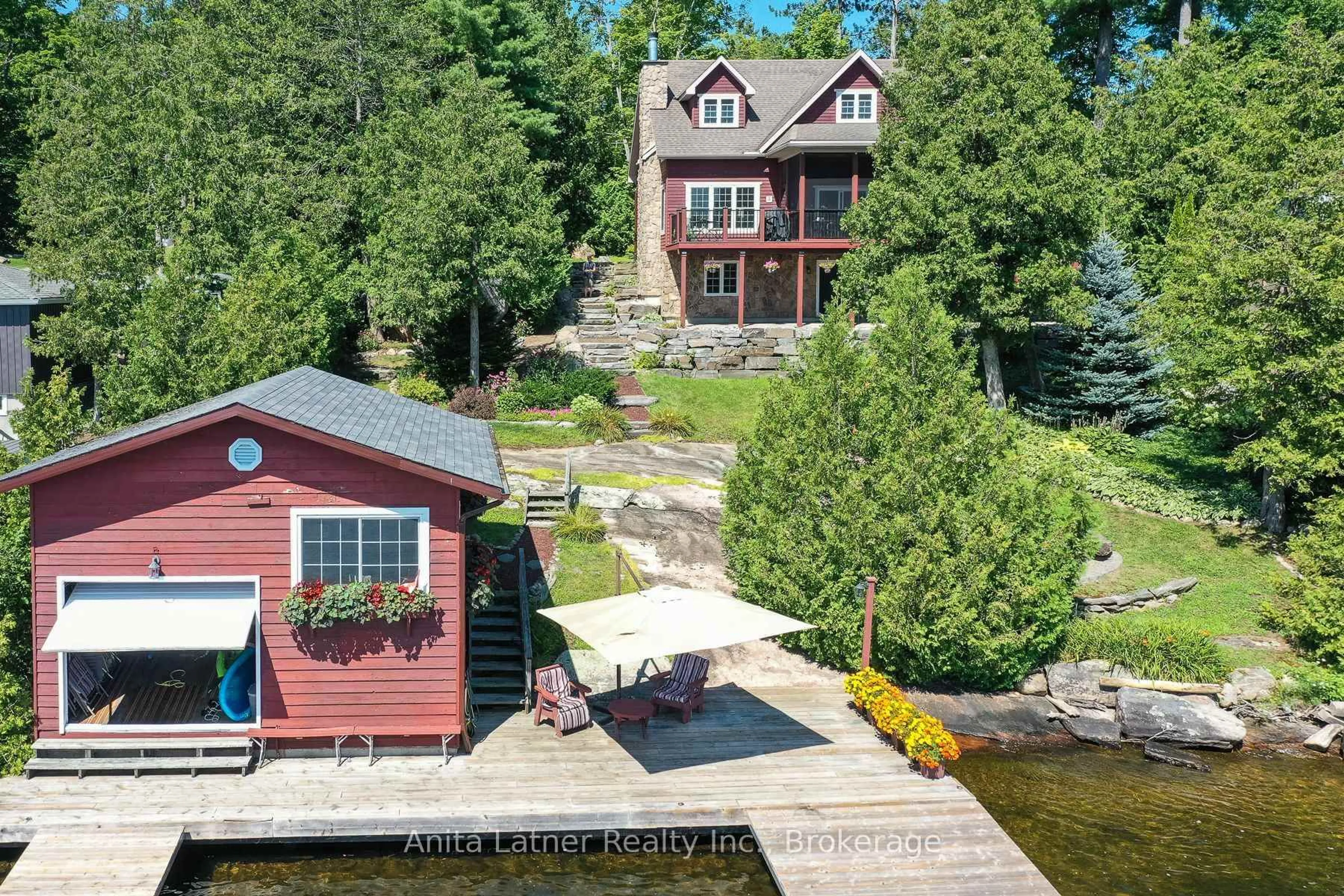 A pic from outside/outdoor area/front of a property/back of a property/a pic from drone, water/lake/river/ocean view for 1180 PARKERS POINT Rd, Gravenhurst Ontario P1P 1R2
