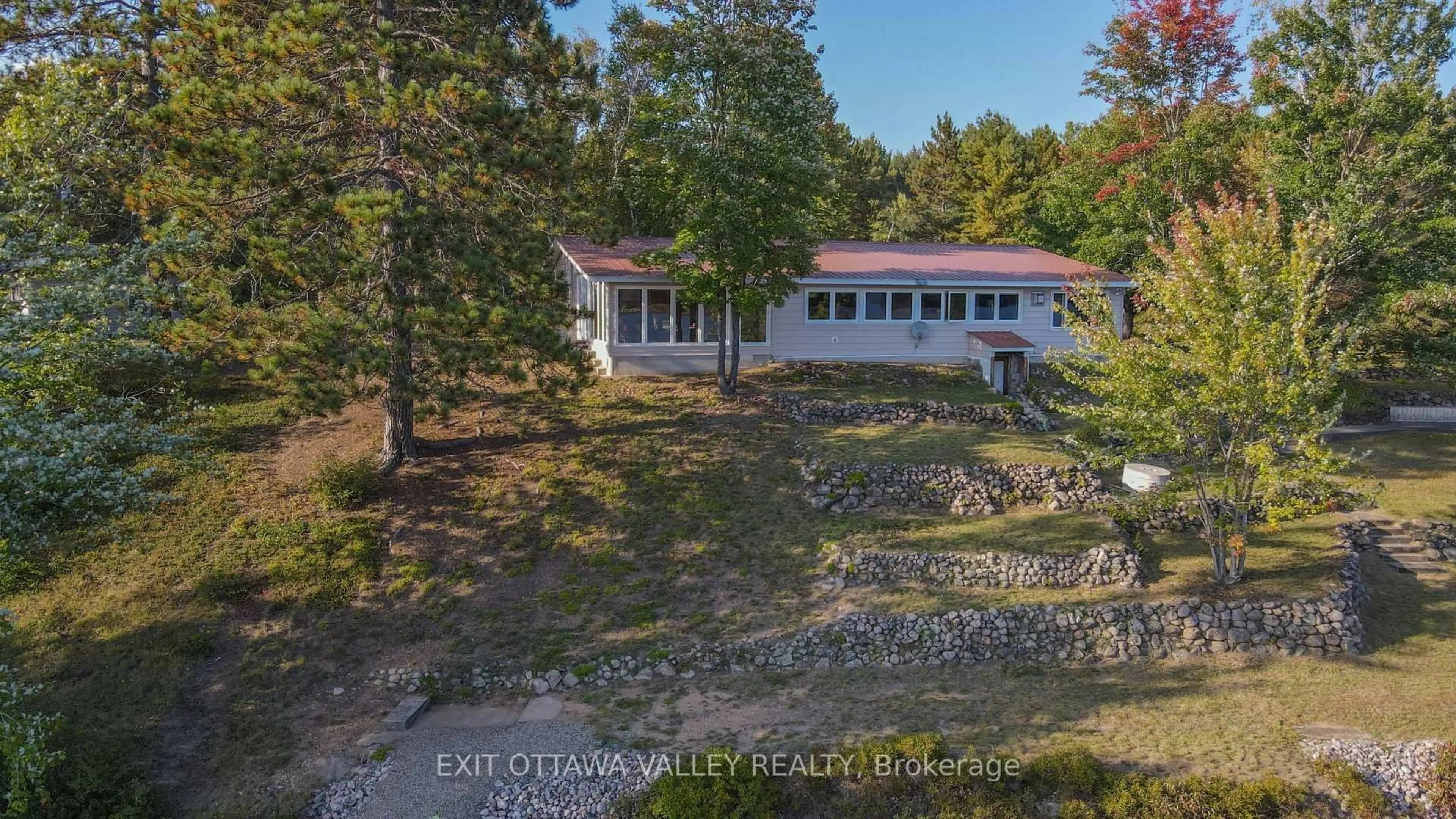 A pic from outside/outdoor area/front of a property/back of a property/a pic from drone, water/lake/river/ocean view for 885 Gunns Rd, Round Lake Centre Ontario K0J 2J0