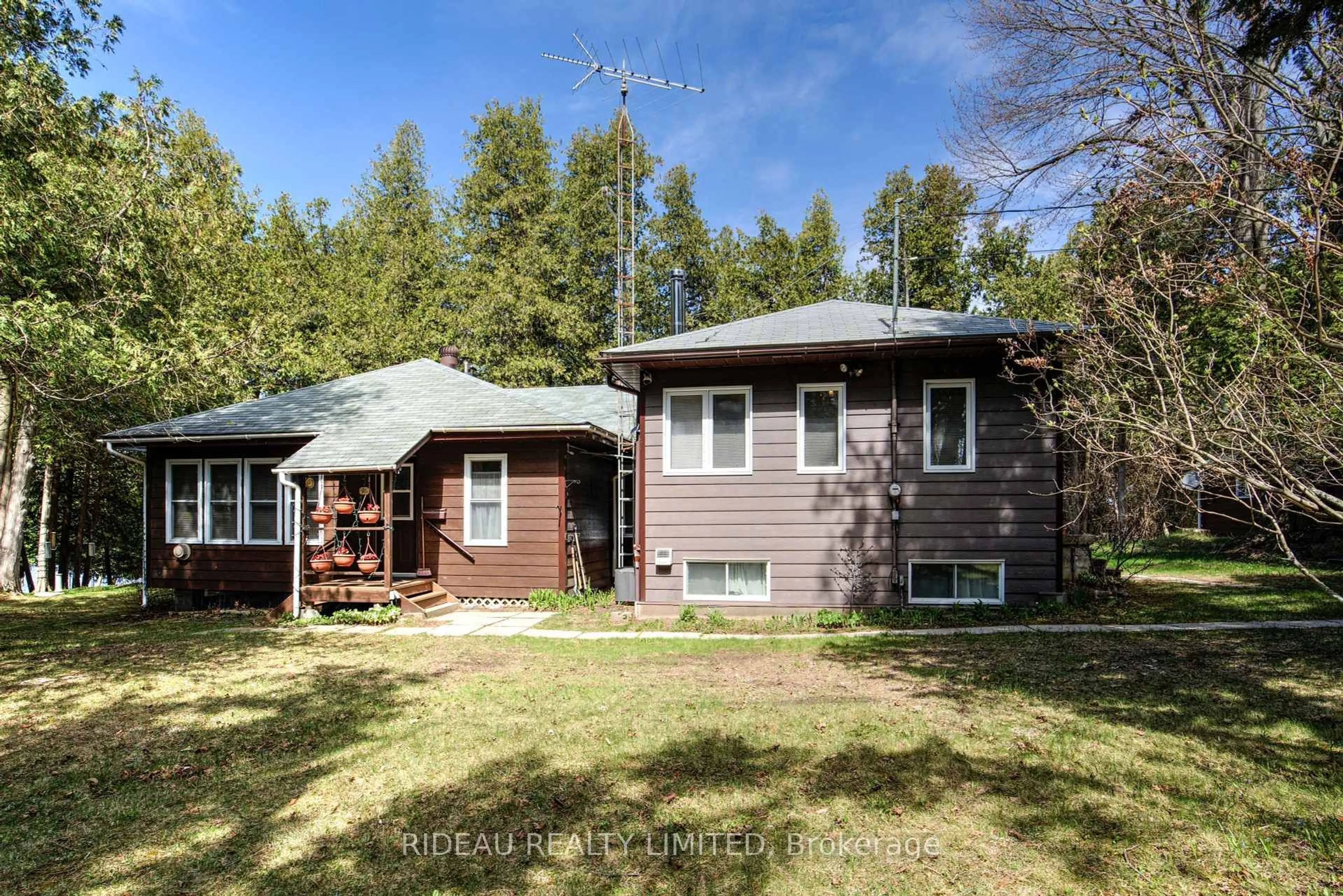 A pic from outside/outdoor area/front of a property/back of a property/a pic from drone, forest/trees view for 3801A Big Rideau Lake Rd, Rideau Lakes Ontario K0G 1V0