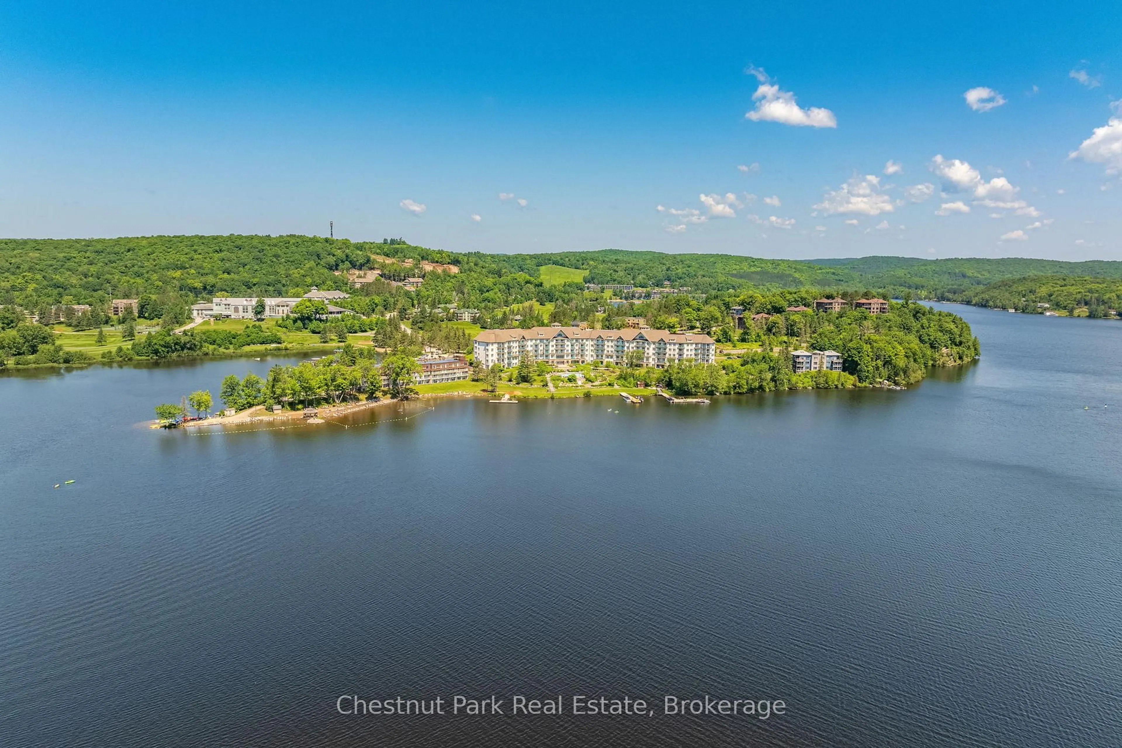 A pic from outside/outdoor area/front of a property/back of a property/a pic from drone, water/lake/river/ocean view for 25 Pen Lake Point Rd #117, Huntsville Ontario P1H 1A9