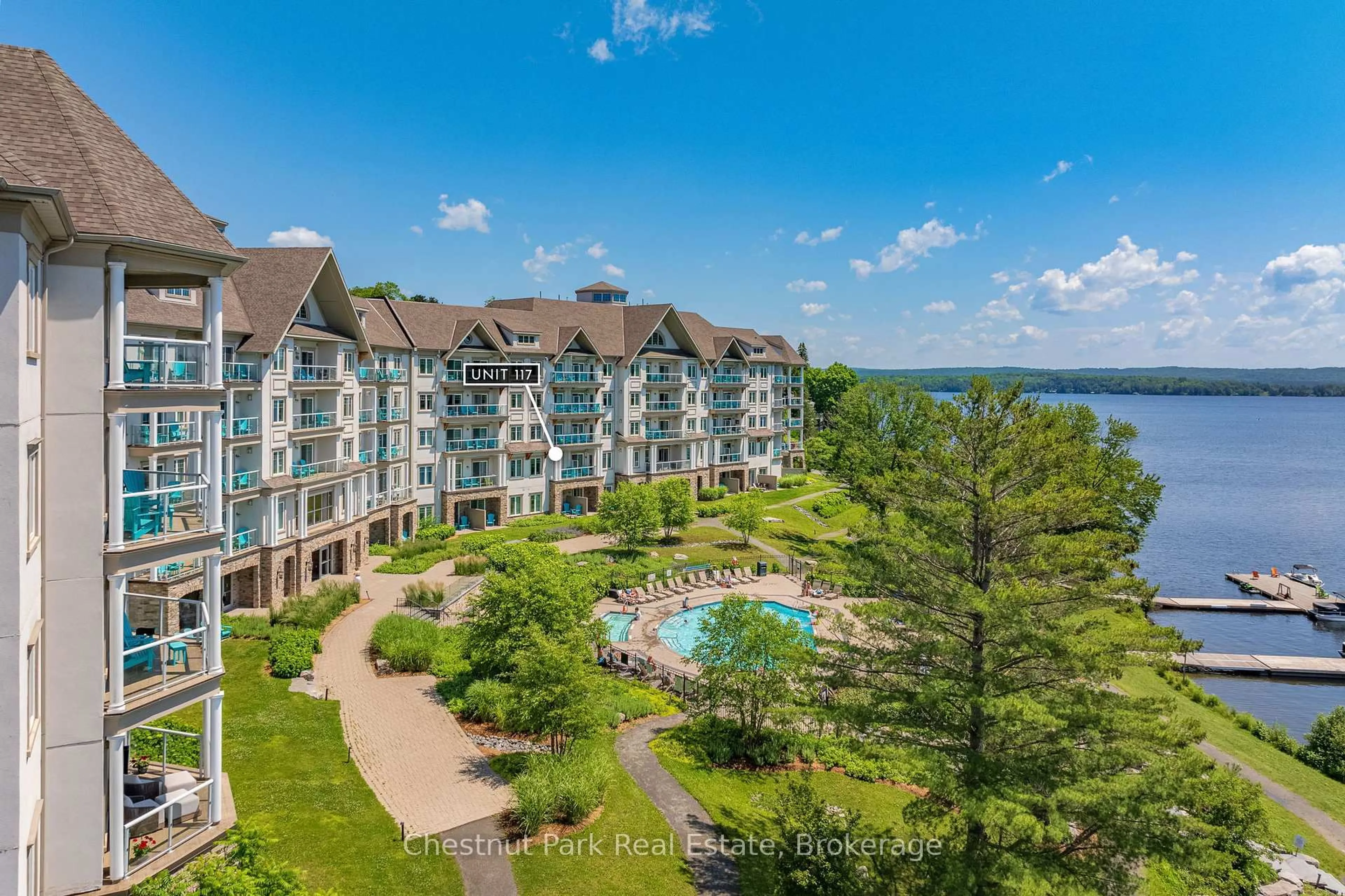 A pic from outside/outdoor area/front of a property/back of a property/a pic from drone, water/lake/river/ocean view for 25 Pen Lake Point Rd #117, Huntsville Ontario P1H 1A9