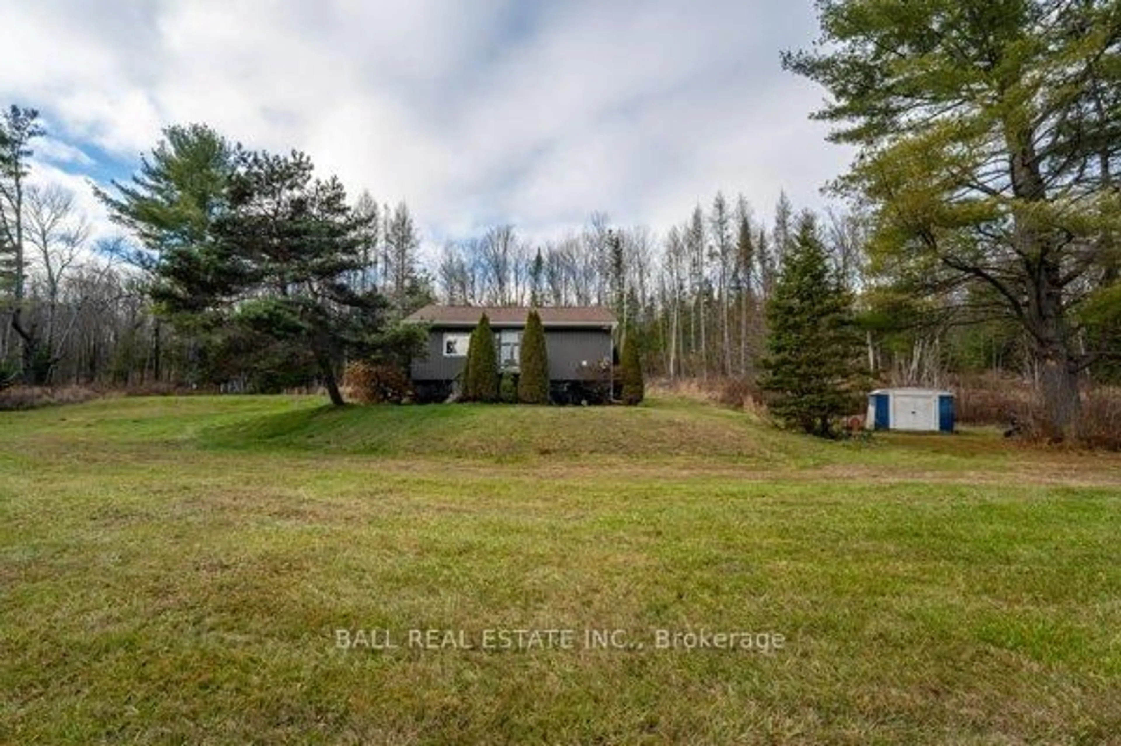 A pic from outside/outdoor area/front of a property/back of a property/a pic from drone, forest/trees view for 1047 Donroy Rd, Highlands East Ontario K0M 1R0