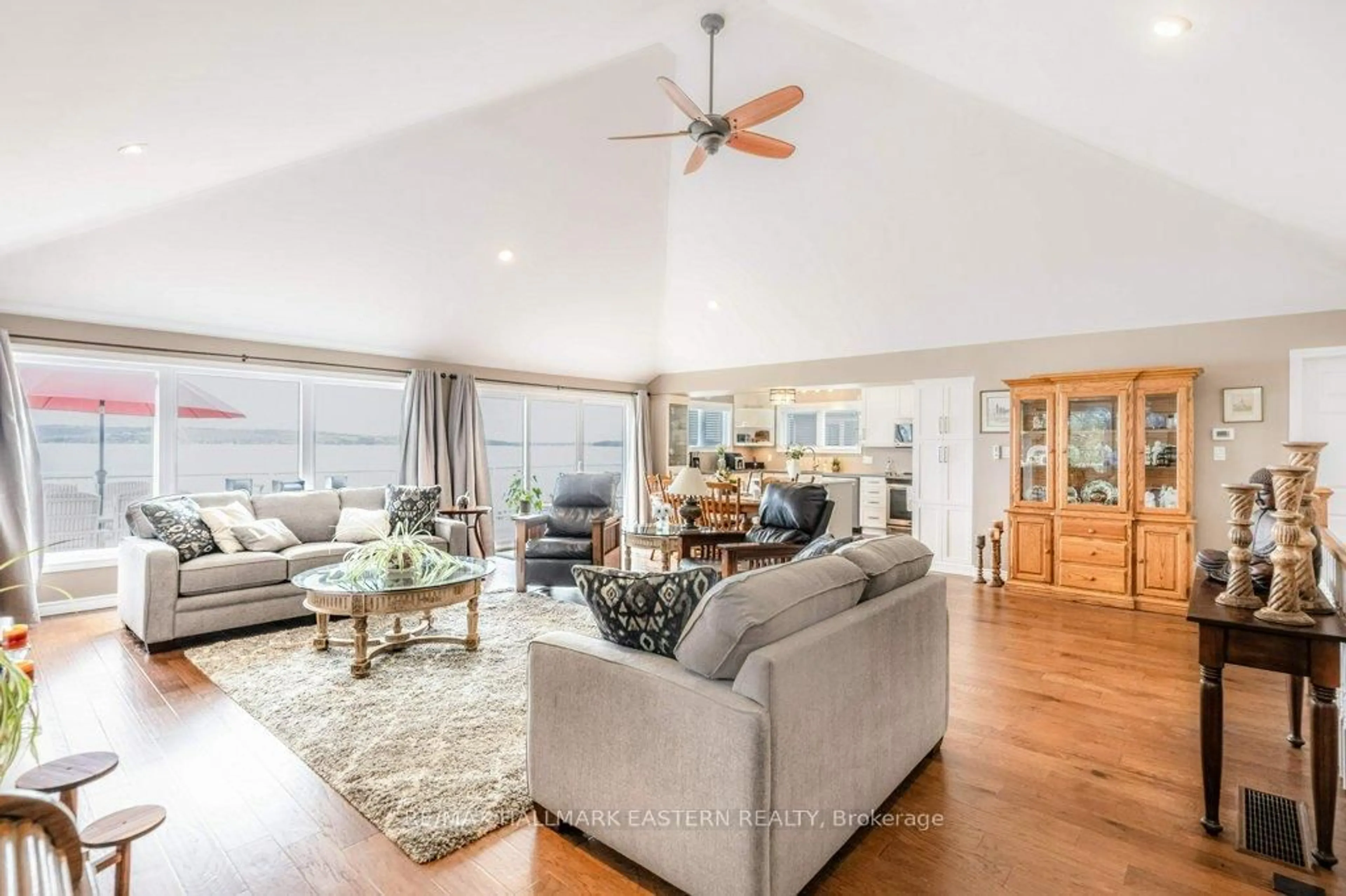 Living room with furniture, wood/laminate floor for 7934 Taits Beach Rd, Hamilton Township Ontario K0L 1E0