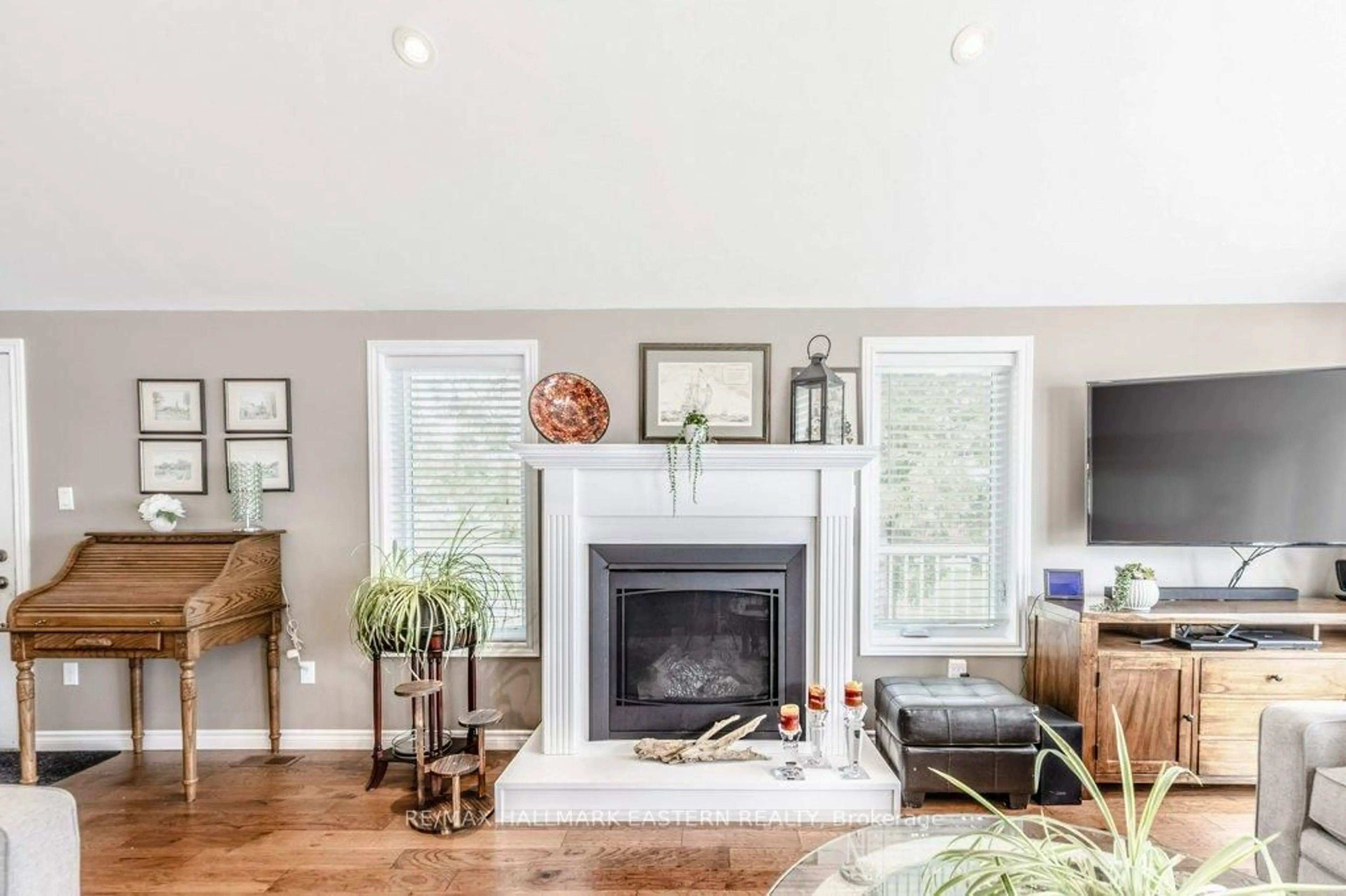 Living room with furniture, wood/laminate floor for 7934 Taits Beach Rd, Hamilton Township Ontario K0L 1E0