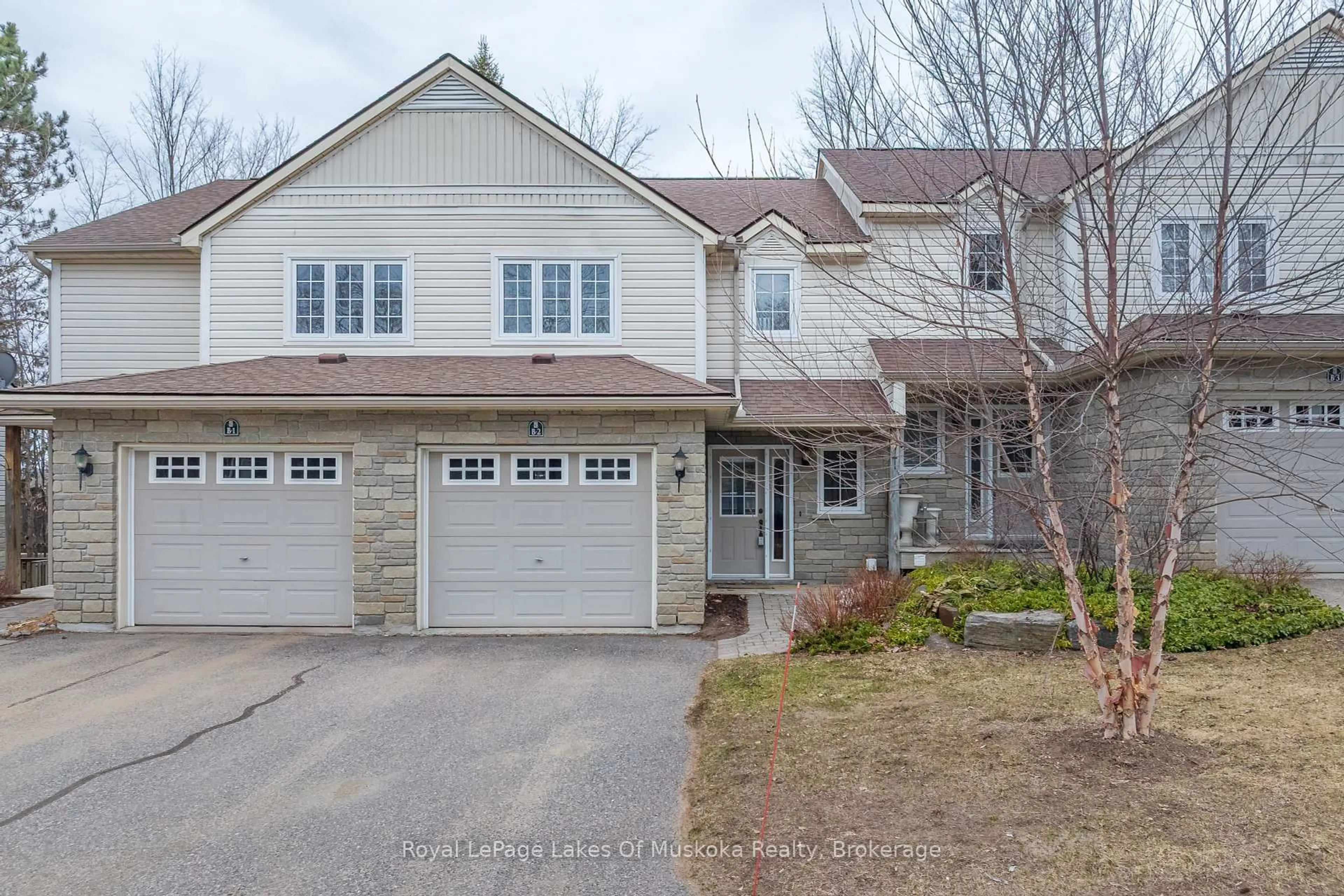 A pic from outside/outdoor area/front of a property/back of a property/a pic from drone, street for 20 Dairy Lane #B2, Huntsville Ontario P1H 2L1