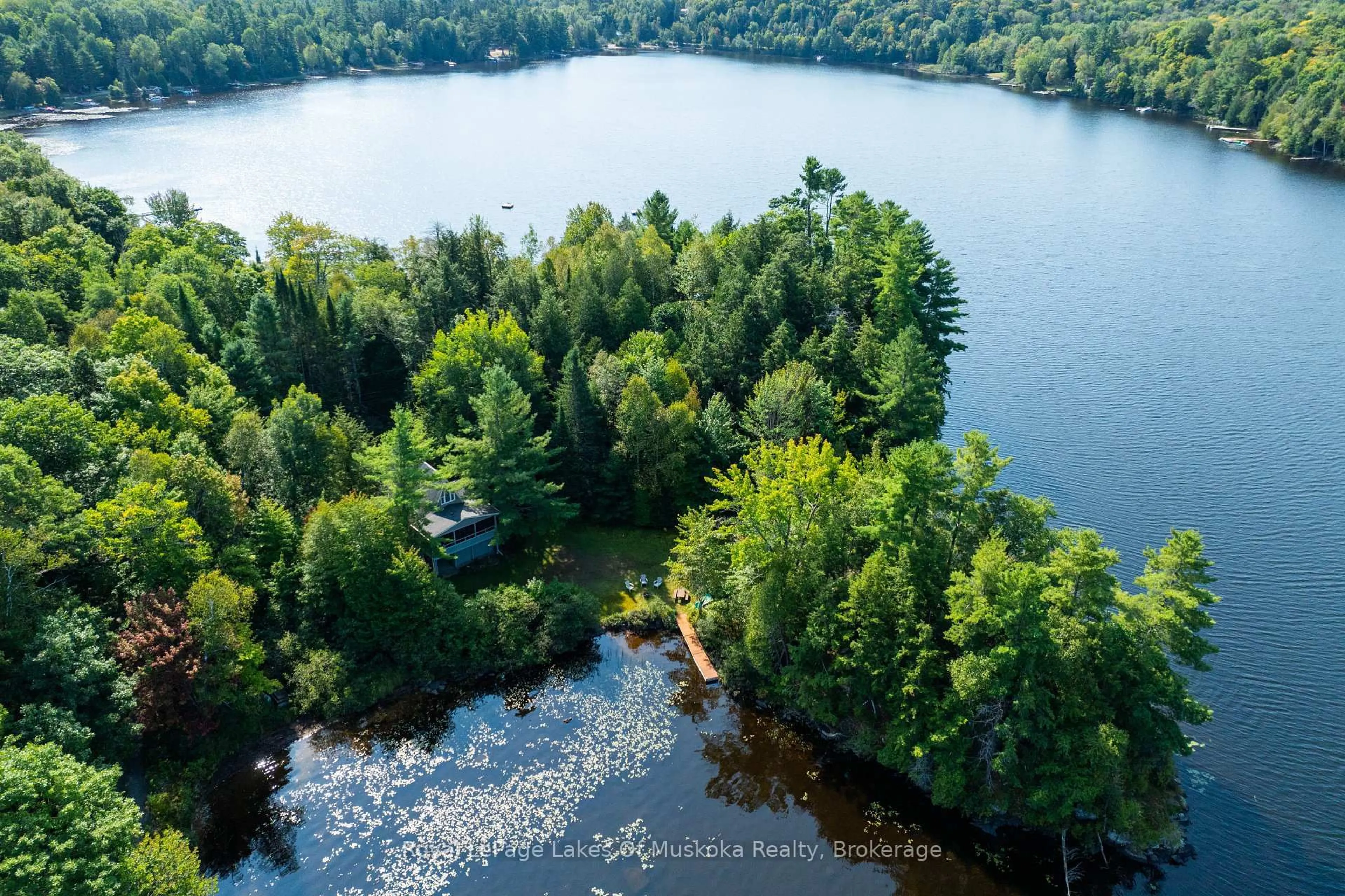 A pic from outside/outdoor area/front of a property/back of a property/a pic from drone, water/lake/river/ocean view for 1025 McCabe Rd, Lake of Bays Ontario P0B 1A0
