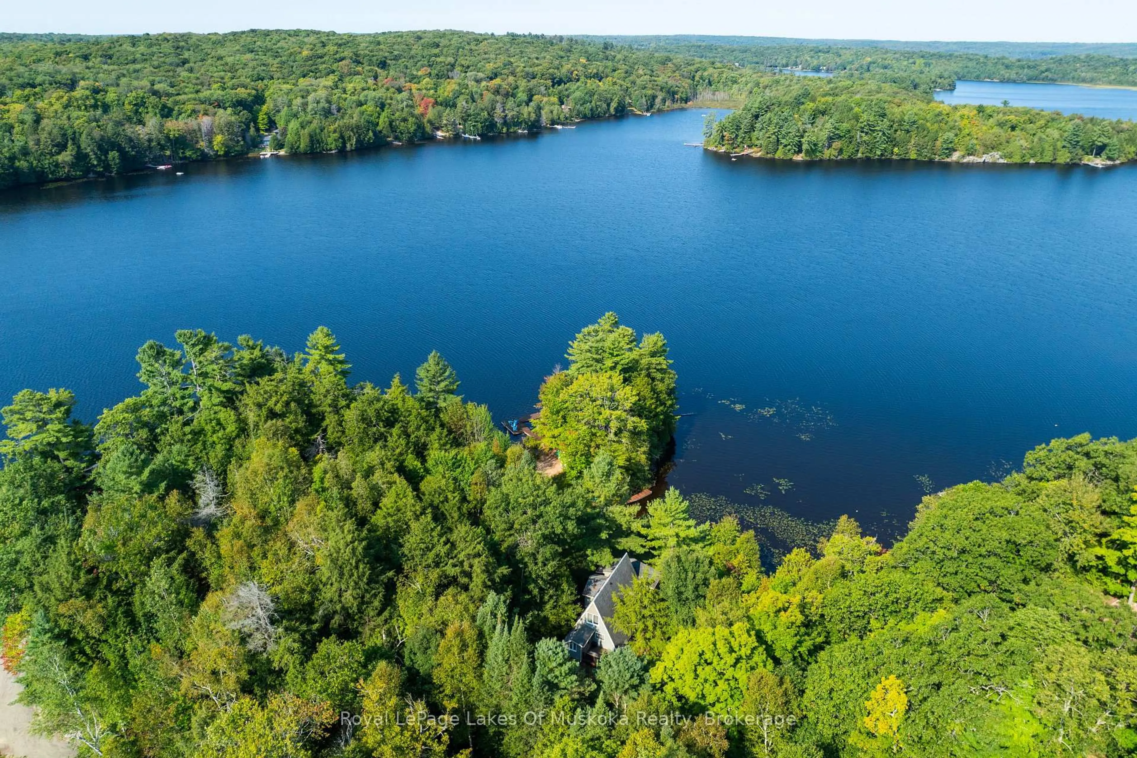A pic from outside/outdoor area/front of a property/back of a property/a pic from drone, water/lake/river/ocean view for 1025 McCabe Rd, Lake of Bays Ontario P0B 1A0