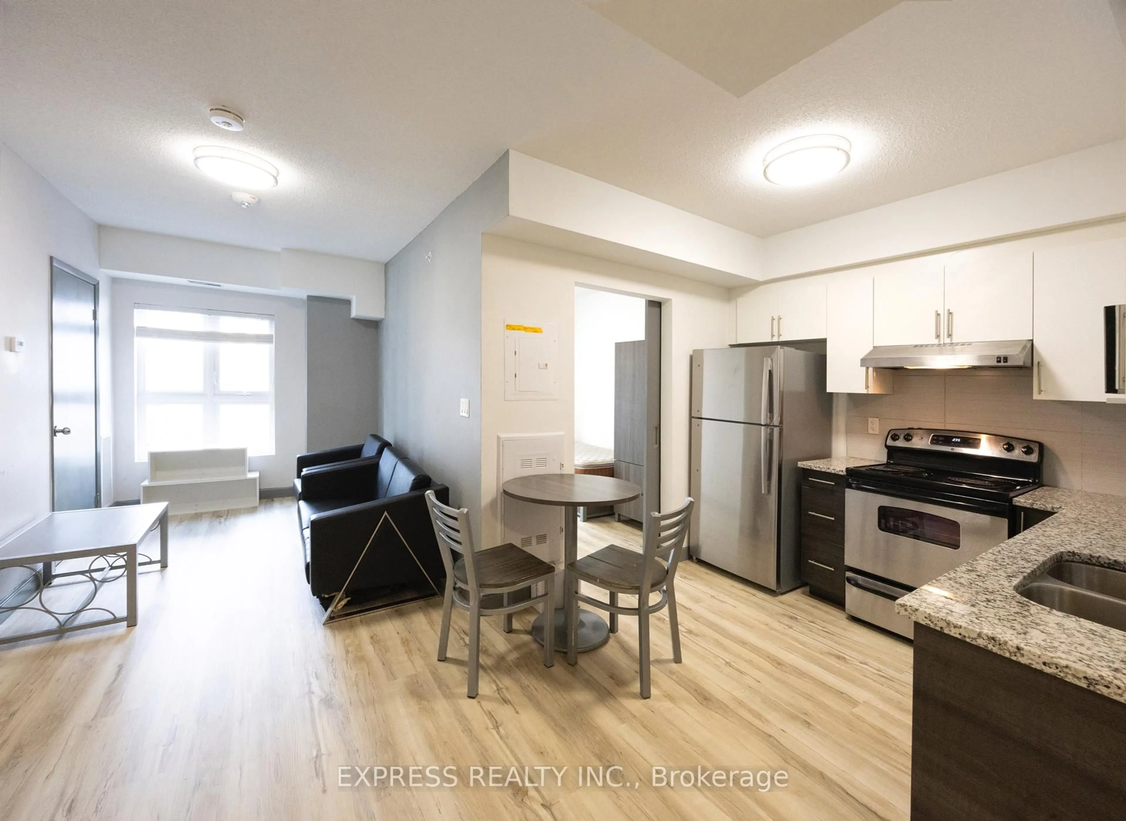Open concept kitchen, wood/laminate floor for 258B Sunview St #2212, Waterloo Ontario N2L 0H7